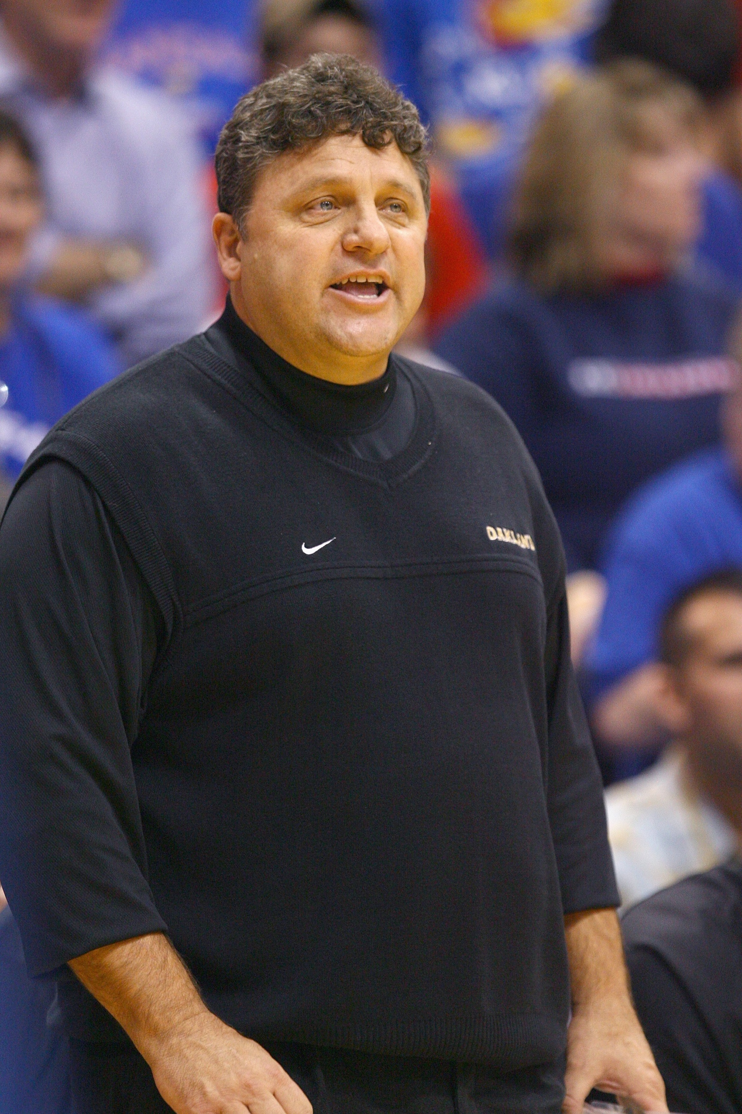 LAWRENCE, KS - NOVEMBER 25:  Head coach Greg Kampeof the Oakland Golden Grizzlies watches the action against the Kansas Jayhawks on November 25, 2009 at Allen Fieldhouse in Lawrence, Kansas. (Photo by Jamie Squire/Getty Images)