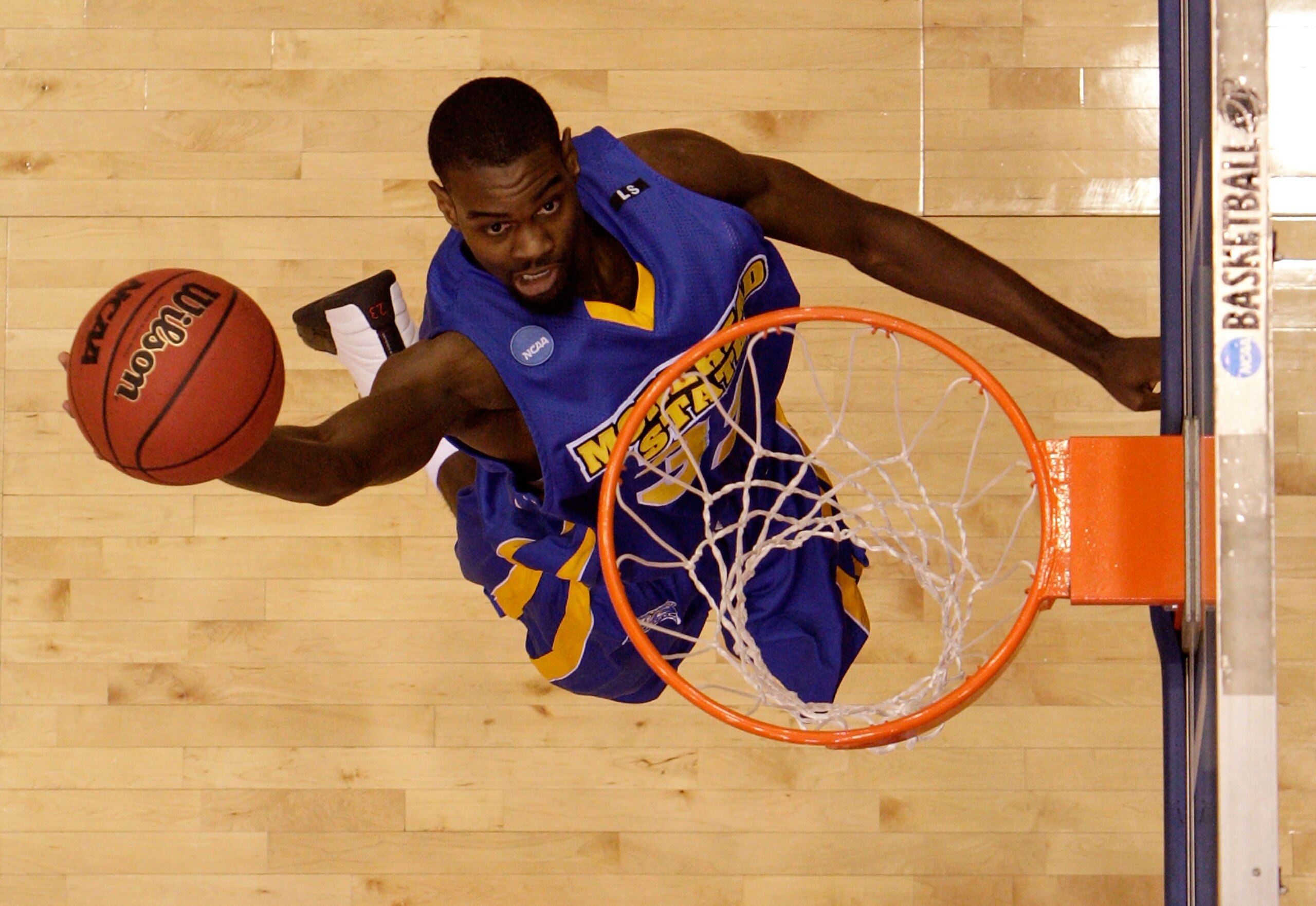 DAYTON, OH - MARCH 20: Steve Peterson #32 of the Morehead State Eagles drives to the hoop against the Louisville Cardinals during the first round of the NCAA Division I Men's Basketball Tournament at the University of Dayton Arena on March 20, 2009 in Day