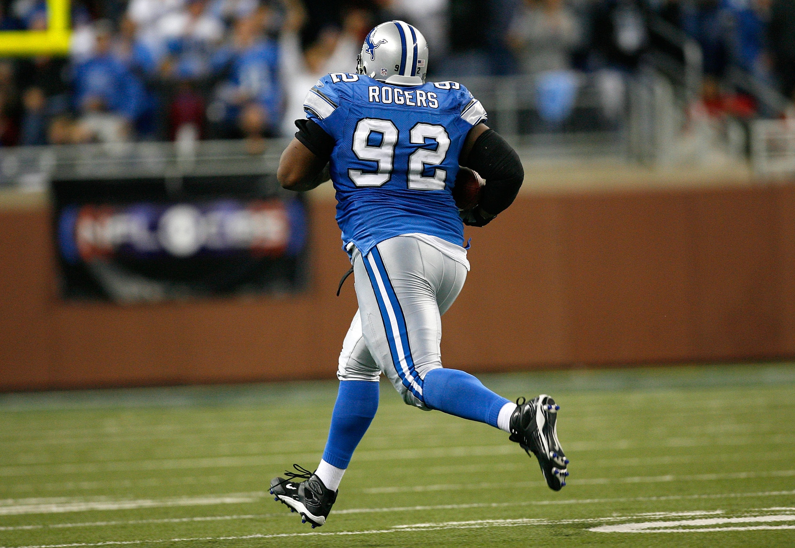 DETROIT - NOVEMBER 04:  Defensive tackle Shaun Rogers #92 of the Detroit Lions returns an interception 66 yards for a touchdown against the Denver Broncos during the second half at Ford Field November 4, 2007 in Detroit, Michigan.  Detroit defeated Denver