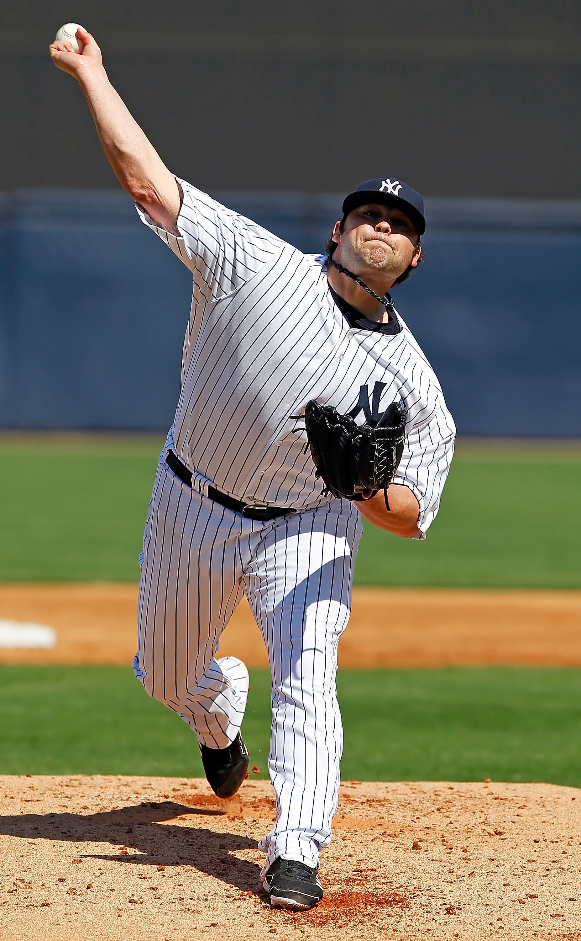 TAMPA, FL - FEBRUARY 26:  Pitcher Joba Chamberlain #62 of the New York Yankees pitches against the Philadelphia Phillies during a Grapefruit League Spring Training Game at George M. Steinbrenner Field on February 26, 2011 in Tampa, Florida.  (Photo by J.