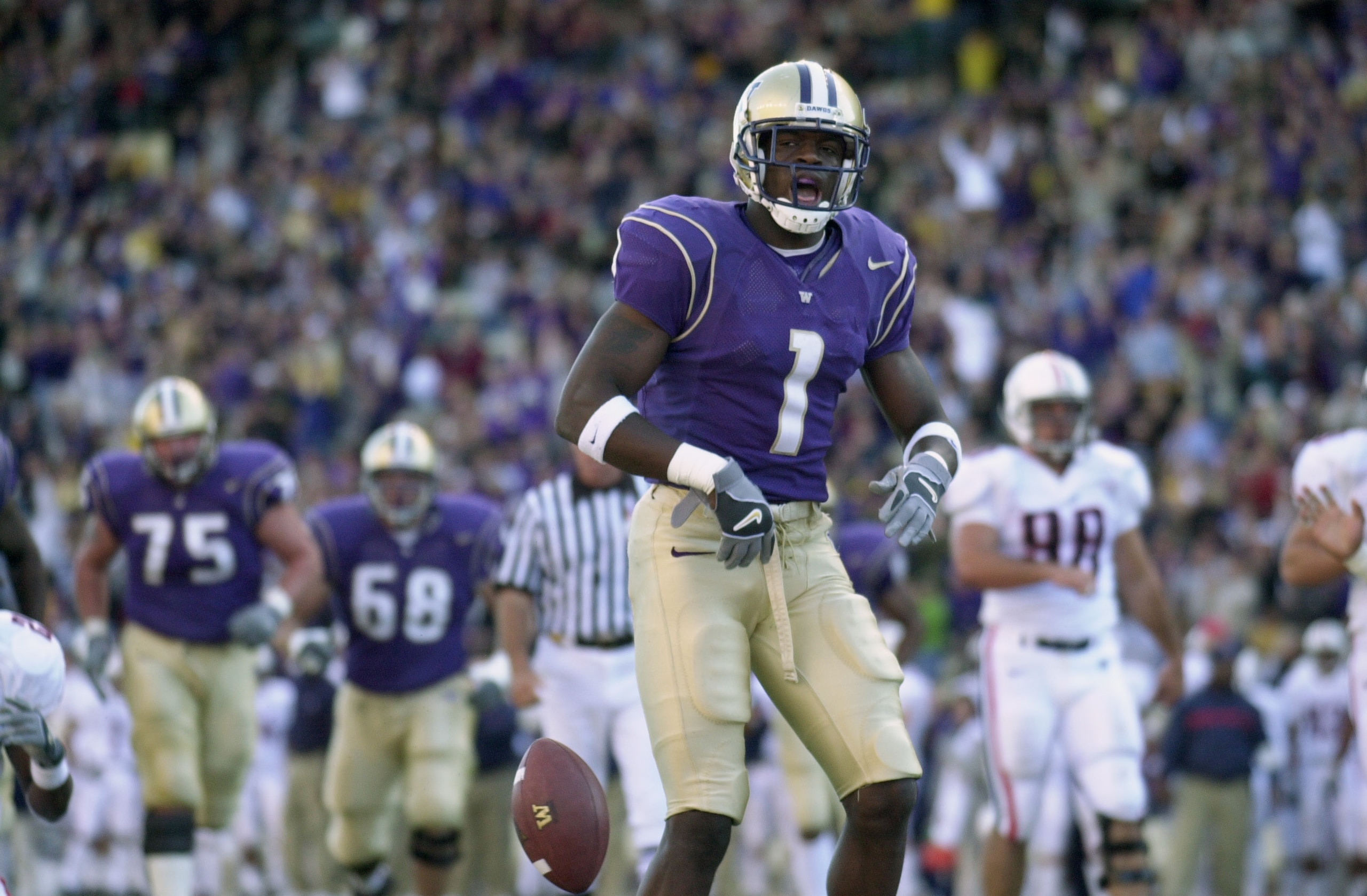 SEATTLE - OCTOBER 12:  Wide receiver Reggie Williams #1 of the Washington Huskies, reacts after scoring a touchdown in the second quarter against the Arizona Wildcats during their game on October 12, 2002 at Husky Stadium in Seattle, Washington. The Huski