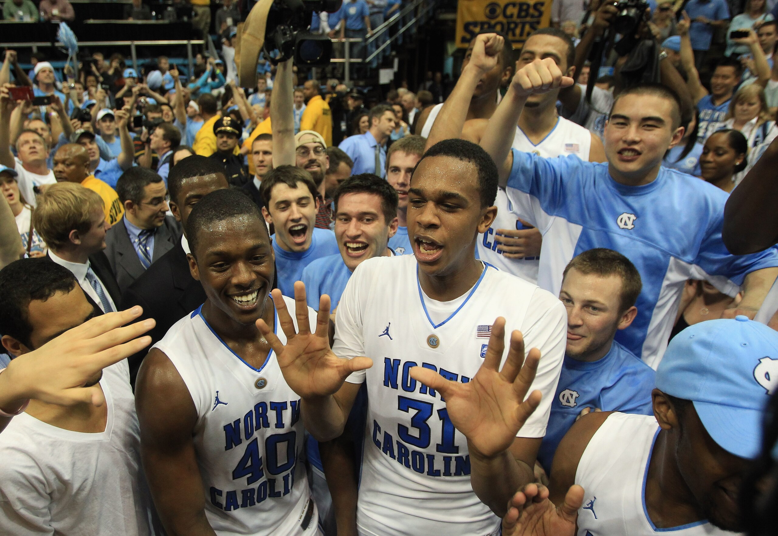 CHAPEL HILL, NC - MARCH 05:  Teammates Harrison Barnes #40 and John Henson #31 of the North Carolina Tar Heels celebrate winning the ACC Regular Season Championship as they defeated the Duke Blue Devils 81-67 at the Dean E. Smith Center on March 5, 2011 i