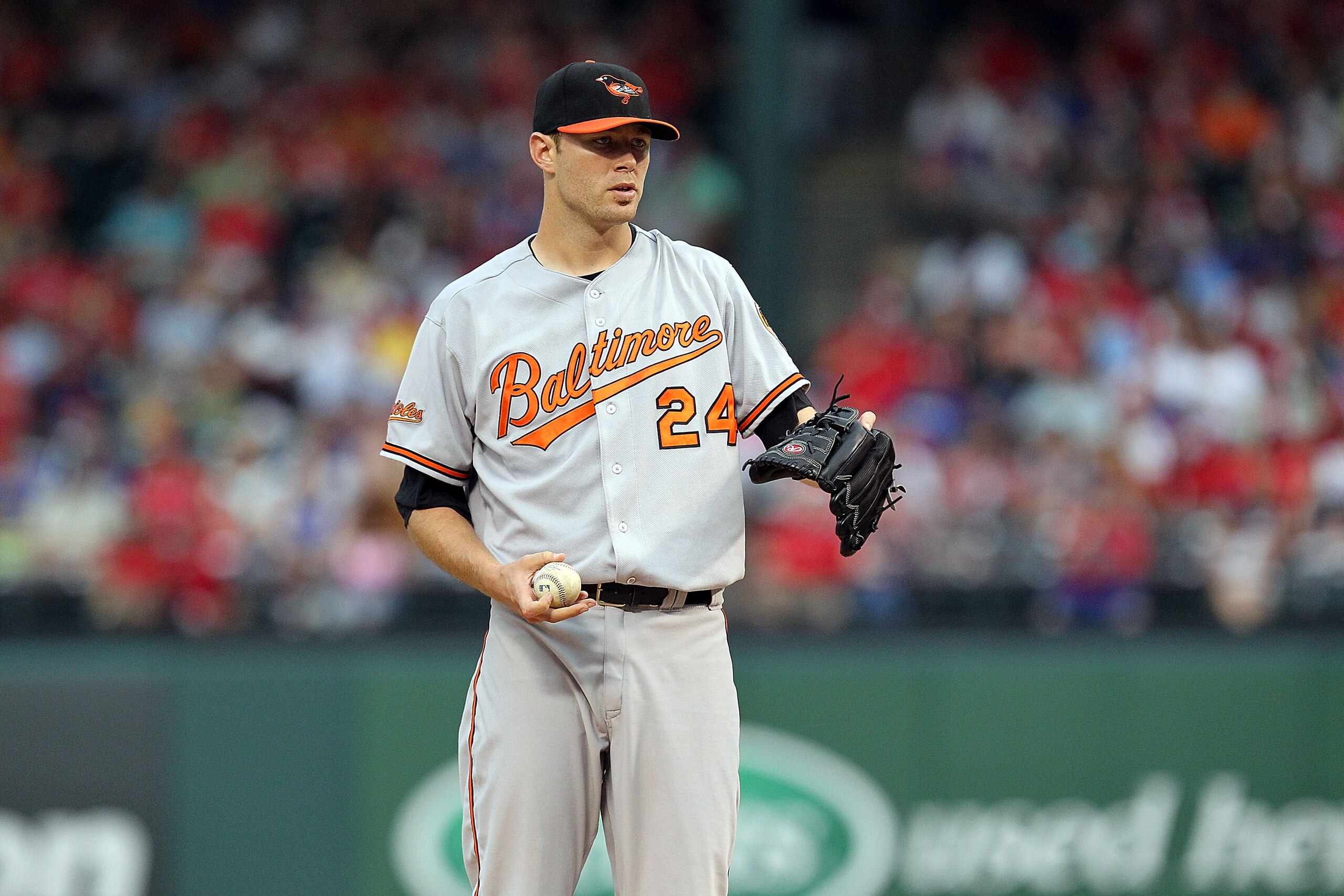 ARLINGTON, TX - JULY 10:  Pitcher Chris Tillman #24 of the Baltimore Orioles throws against the Texas Rangers on July 10, 2010 at Rangers Ballpark in Arlington, Texas.  (Photo by Ronald Martinez/Getty Images)