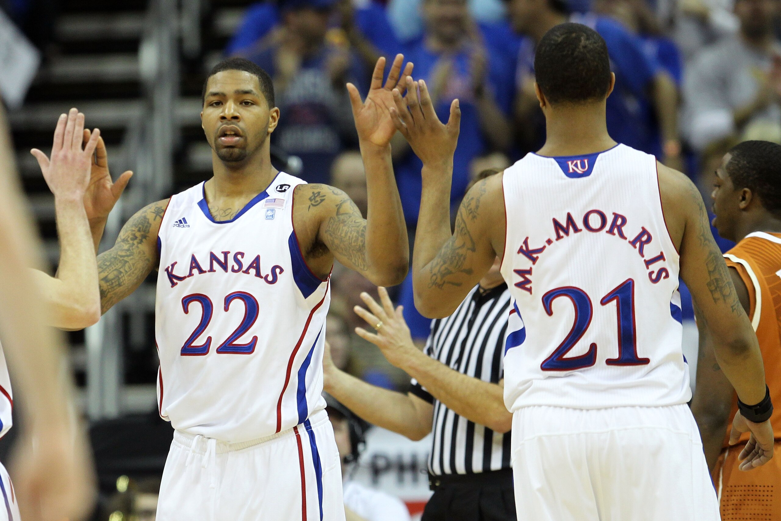 KANSAS CITY, MO - MARCH 12:  Marcus Morris #22 and Markieff Morris #21 of the Kansas Jayhawks react after a play against the Texas Longhorns during the 2011 Phillips 66 Big 12 Men's Basketball Tournament championship game at Sprint Center on March 12, 201