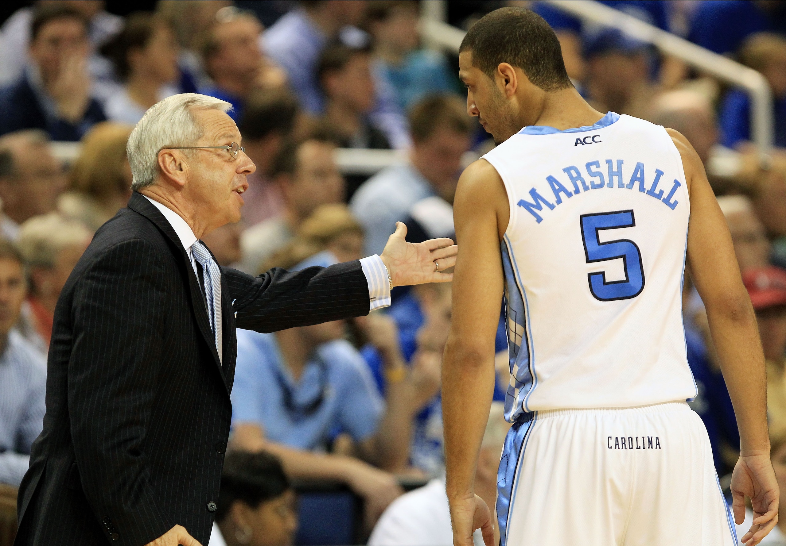 GREENSBORO, NC - MARCH 13:  Head coach Roy Williams of the North Carolina Tar Heels talks with Kendall Marshall #5 during the first half against the Duke Blue Devils in the championship game of the 2011 ACC men's basketball tournament at the Greensboro Co