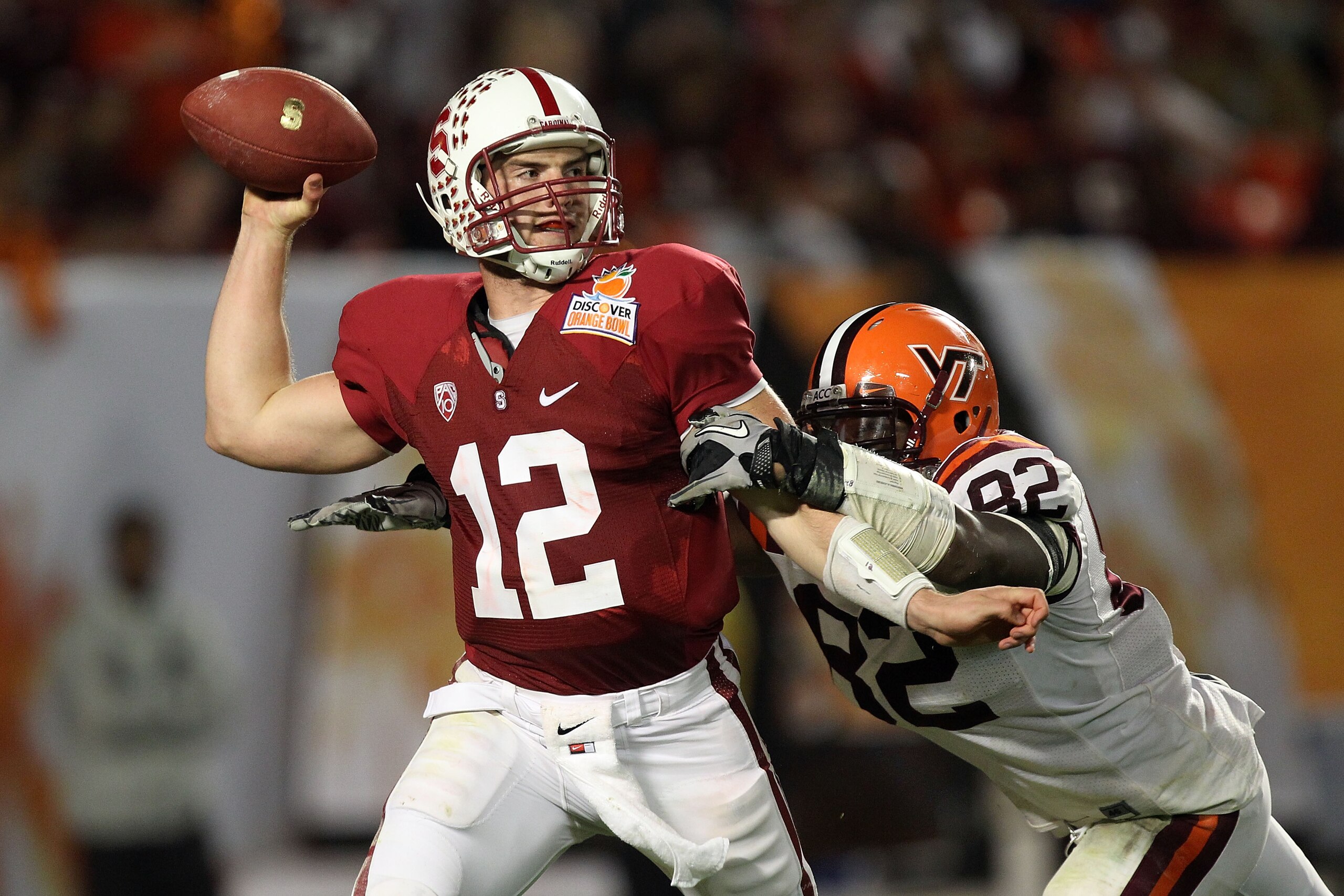 MIAMI, FL - JANUARY 03: Andrew Luck #12 of the Stanford Cardinal throws a pass against Steven Friday #82 of the Virginia Tech Hokies during the 2011 Discover Orange Bowl at Sun Life Stadium on January 3, 2011 in Miami, Florida. (Photo by Streeter Lecka/Ge