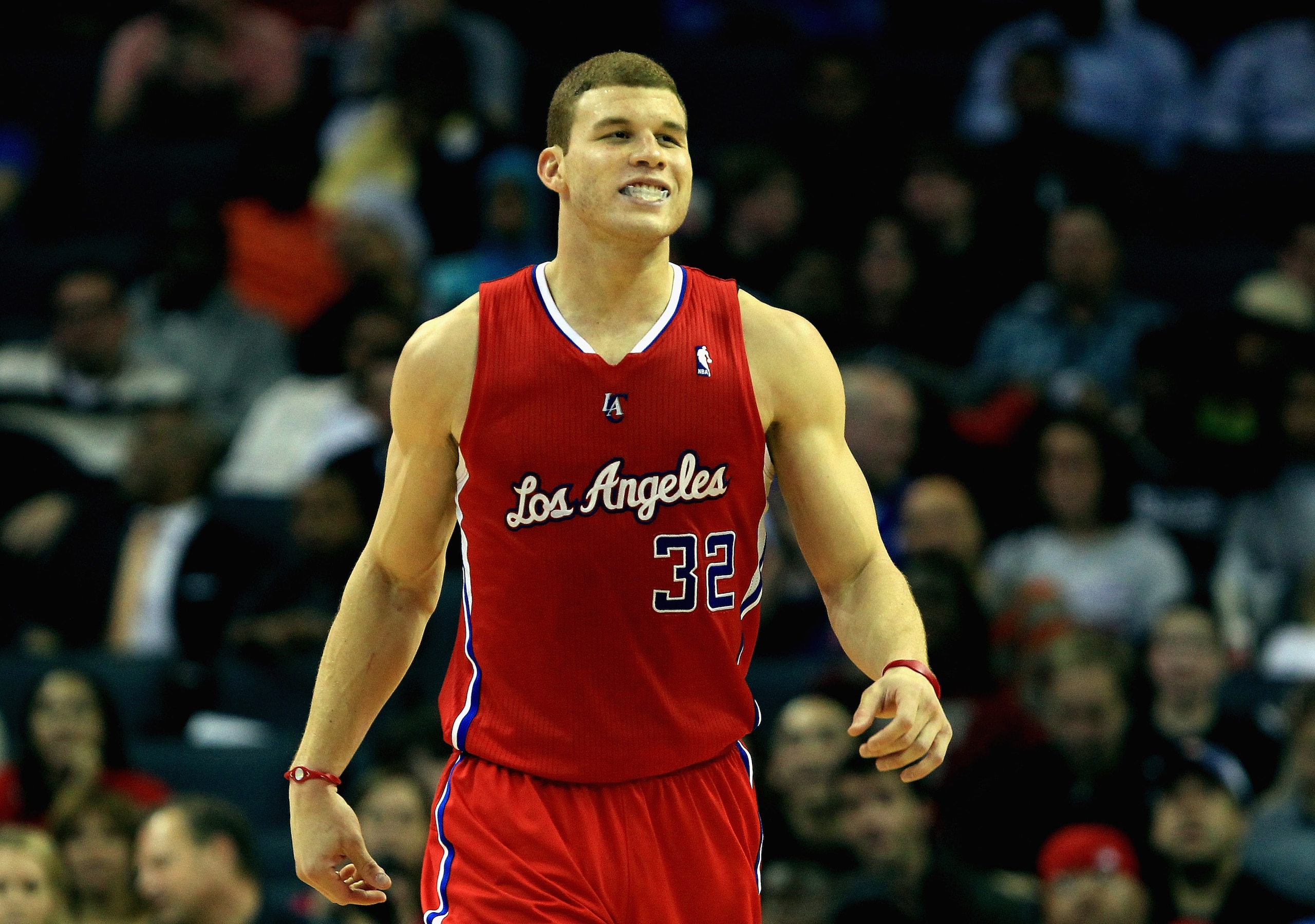 CHARLOTTE, NC - MARCH 07: Blake Griffin #32 of the Los Angeles Clippers smiles as he walks down the court against the Charlotte Bobcats during their 92-87 victory at Time Warner Cable Arena on March 7, 2011 in Charlotte, North Carolina. NOTE TO USER: Use CHARLOTTE, NC - MARCH 07: Blake Griffin #32 of the Los Angeles Clippers smiles as he walks down the court against the Charlotte Bobcats during their 92-87 victory at Time Warner Cable Arena on March 7, 2011 in Charlotte, North Carolina. NOTE TO USER: Use