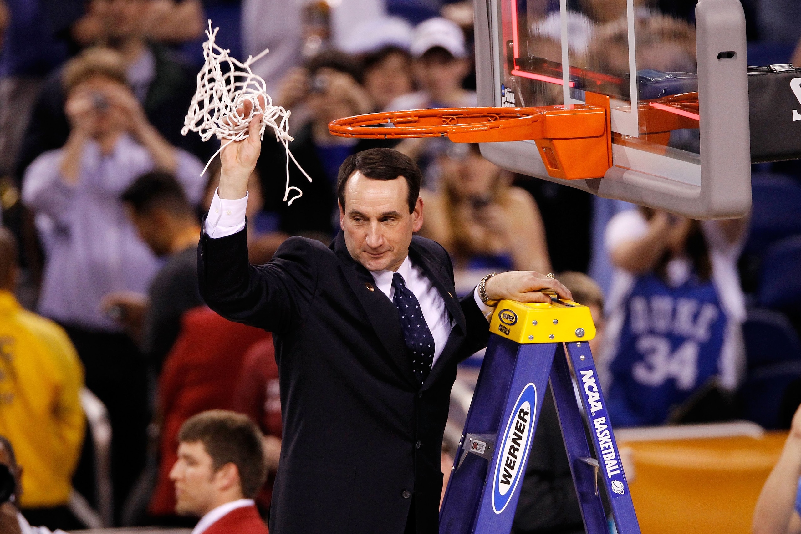 INDIANAPOLIS - APRIL 05: Head coach Mike Krzyzewski of the Duke Blue Devils celebrates after he cut down a piece of the net following their 61-59 win against the Butler Bulldogs during the 2010 NCAA Division I Men's Basketball National Championship game INDIANAPOLIS - APRIL 05: Head coach Mike Krzyzewski of the Duke Blue Devils celebrates after he cut down a piece of the net following their 61-59 win against the Butler Bulldogs during the 2010 NCAA Division I Men's Basketball National Championship game