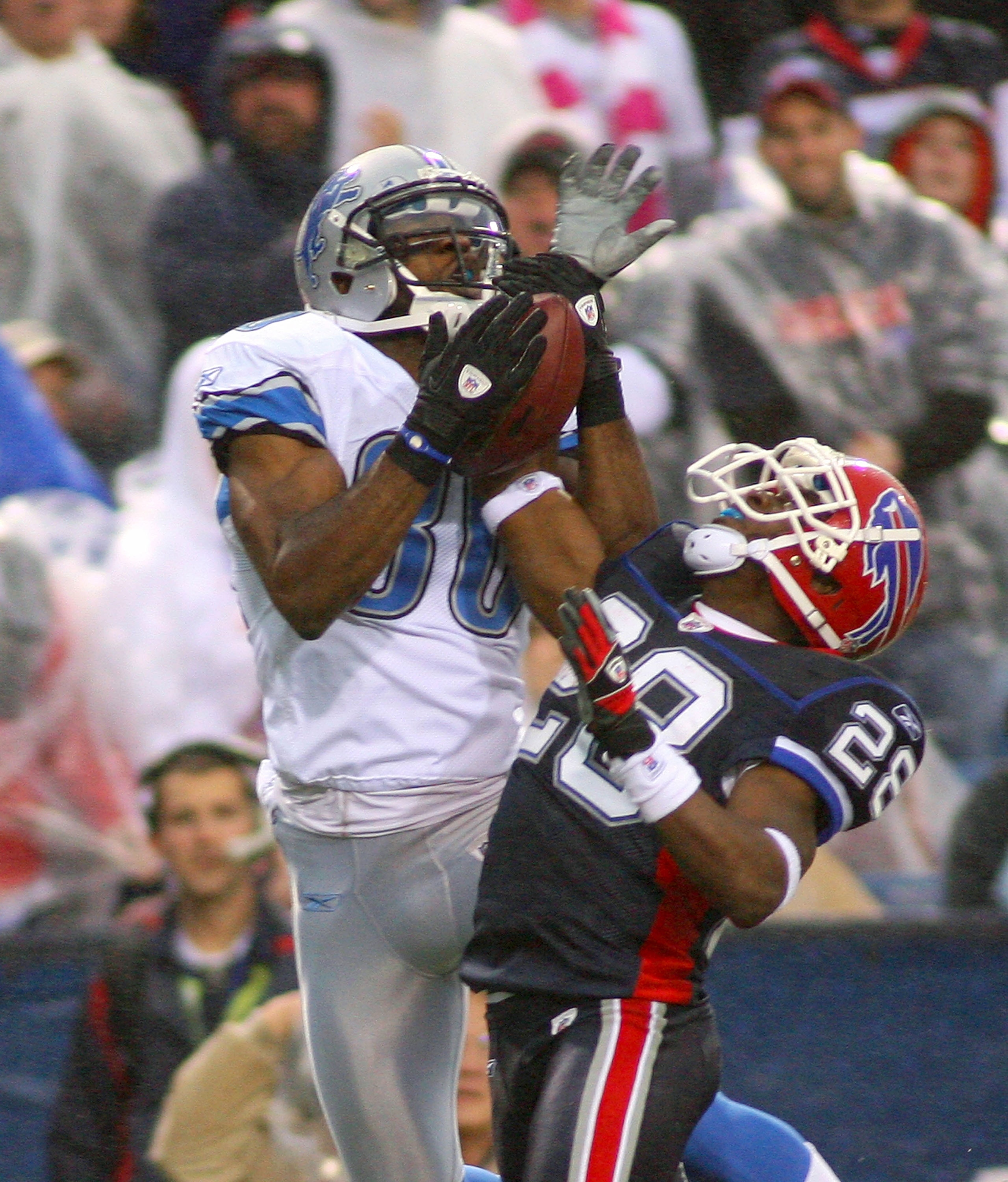 ORCHARD PARK, NY - NOVEMBER 14:  Leodis McKelvin #28 of the Buffalo Bills strips the ball away from Calvin Johnson #81 of the Detroit Lions at Ralph Wilson Stadium on November 14, 2010 in Orchard Park, New York. Buffalo won 14-12.  (Photo by Rick Stewart/