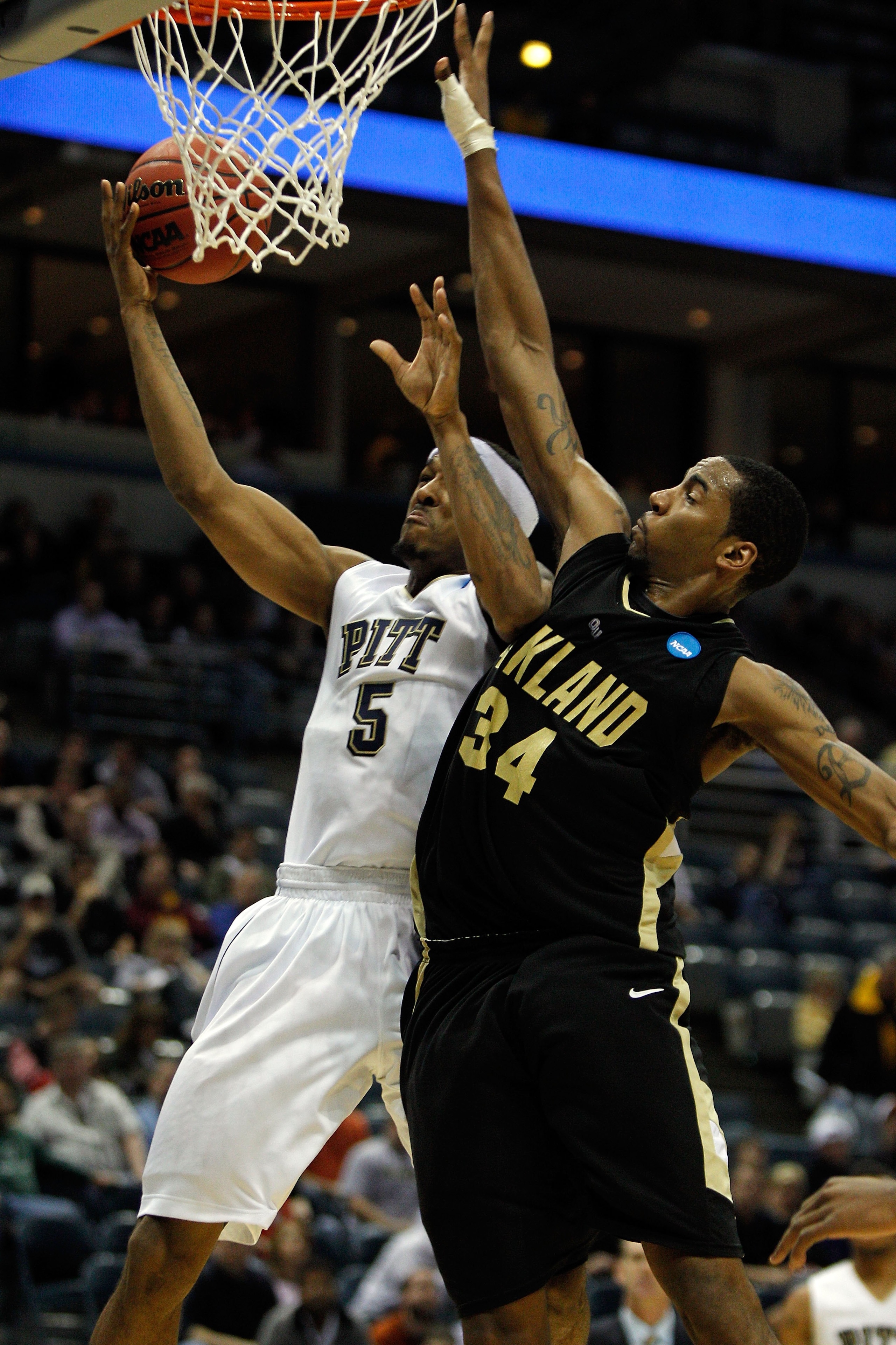 MILWAUKEE - MARCH 19:  Gilbert Brown #5 of the Pittsburgh Panthers goes up for a shot against Keith Benson #34 of the Oakland Golden Grizzlies during the first round of the 2010 NCAA men's basketball tournament at the Bradley Center on March 19, 2010 in M