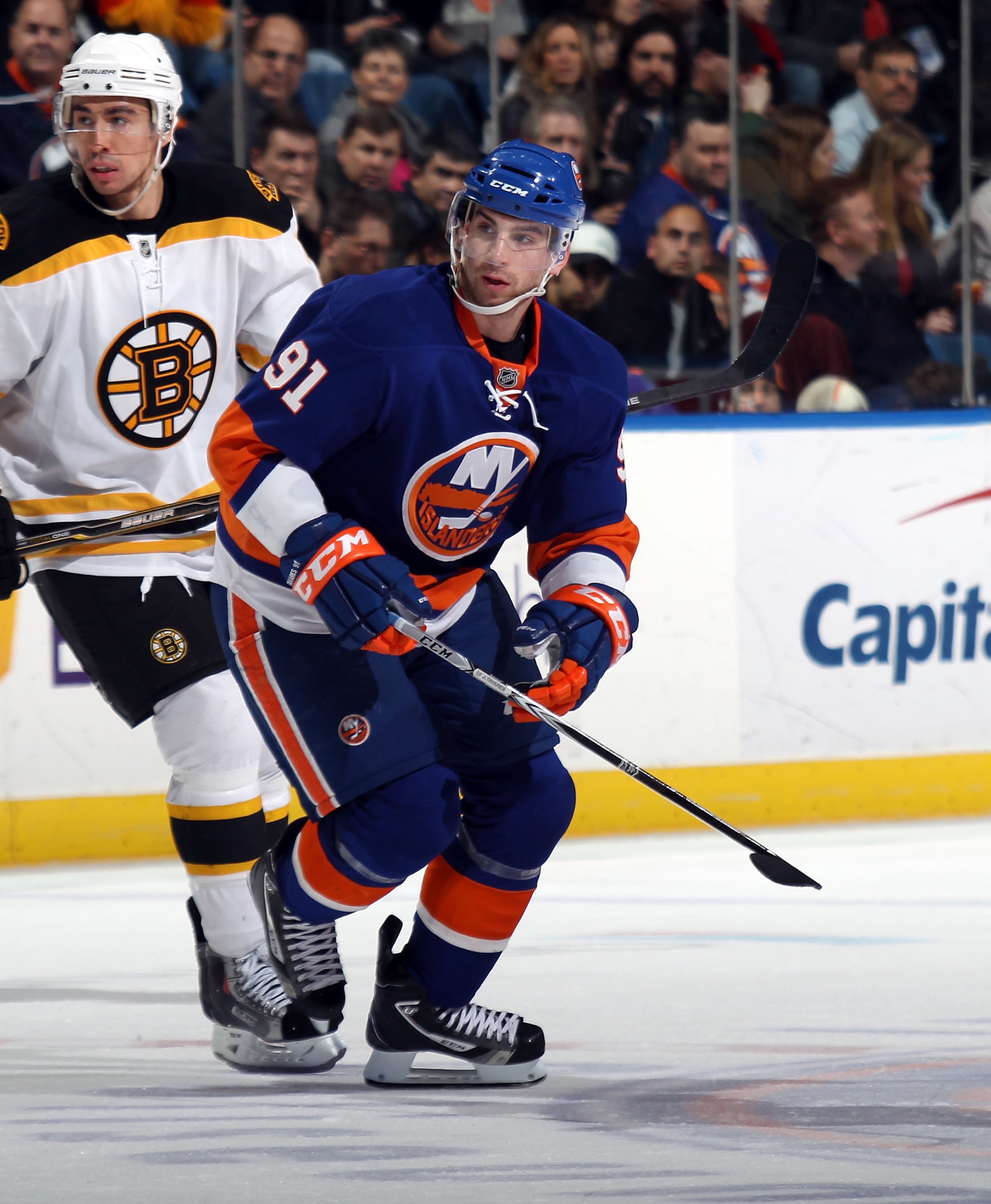 UNIONDALE, NY - MARCH 11:  John Tavares #91 of the New York Islanders skates against the Boston Bruins at the Nassau Coliseum on March 11, 2011 in Uniondale, New York.  (Photo by Bruce Bennett/Getty Images)