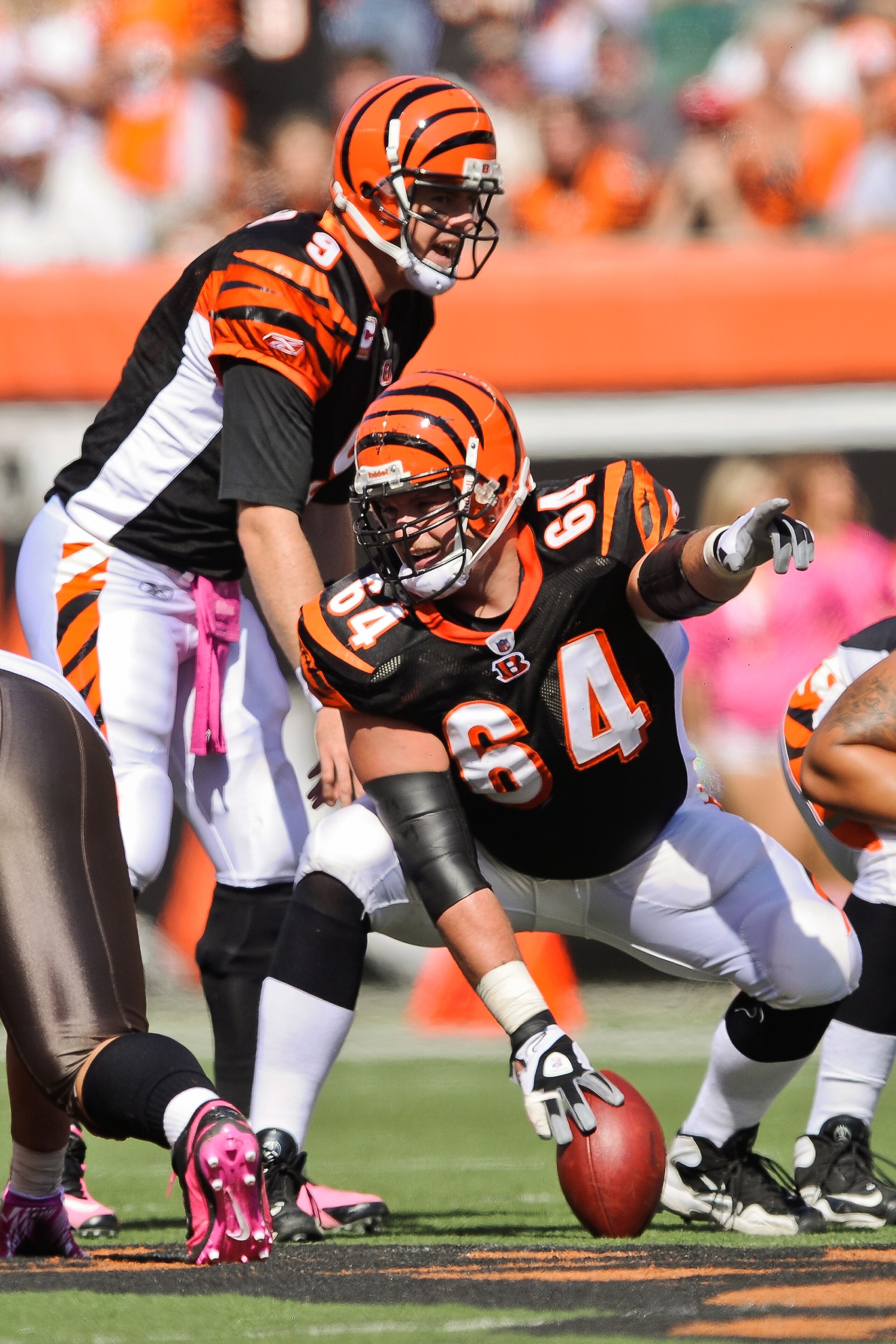 CINCINNATI, OH - OCTOBER 10: Center Kyle Cook #64 of the Cincinnati Bengals points out a blocking assignment against the Tampa Bay Buccaneers at Paul Brown Stadium on October 10, 2010 in Cincinnati, Ohio. (Photo by Jamie Sabau/Getty Images)