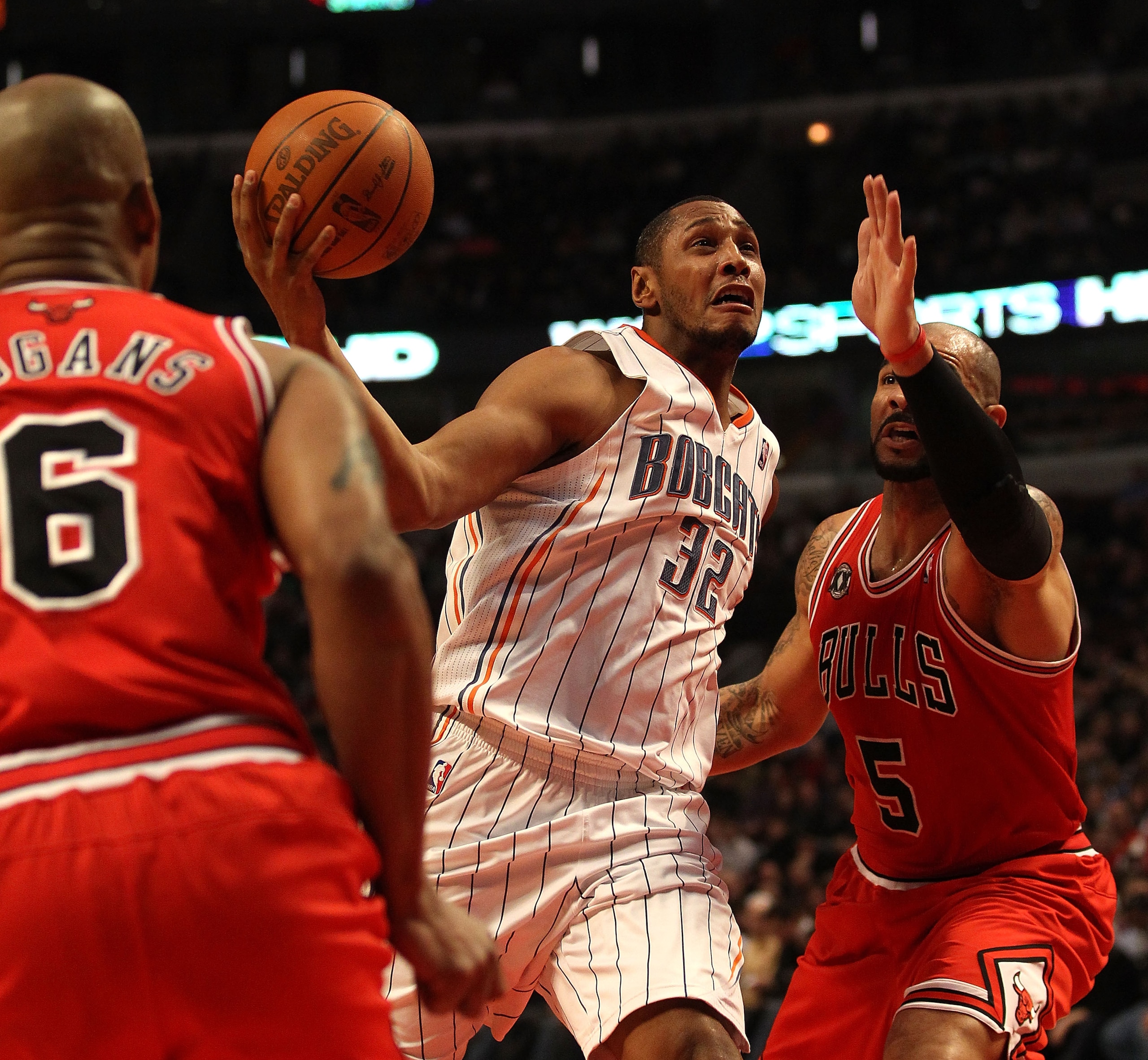 CHICAGO, IL - FEBRUARY 15: Boris Diaw #32 of the Charlotte Bobcats goes up for a shot between Carlos Boozer #5 and Keith Bogans #6 of the Chicago Bulls at the United Center on February 15, 2011 in Chicago, Illinois. The Bulls defeated the Bobcats 106-94. CHICAGO, IL - FEBRUARY 15: Boris Diaw #32 of the Charlotte Bobcats goes up for a shot between Carlos Boozer #5 and Keith Bogans #6 of the Chicago Bulls at the United Center on February 15, 2011 in Chicago, Illinois. The Bulls defeated the Bobcats 106-94.