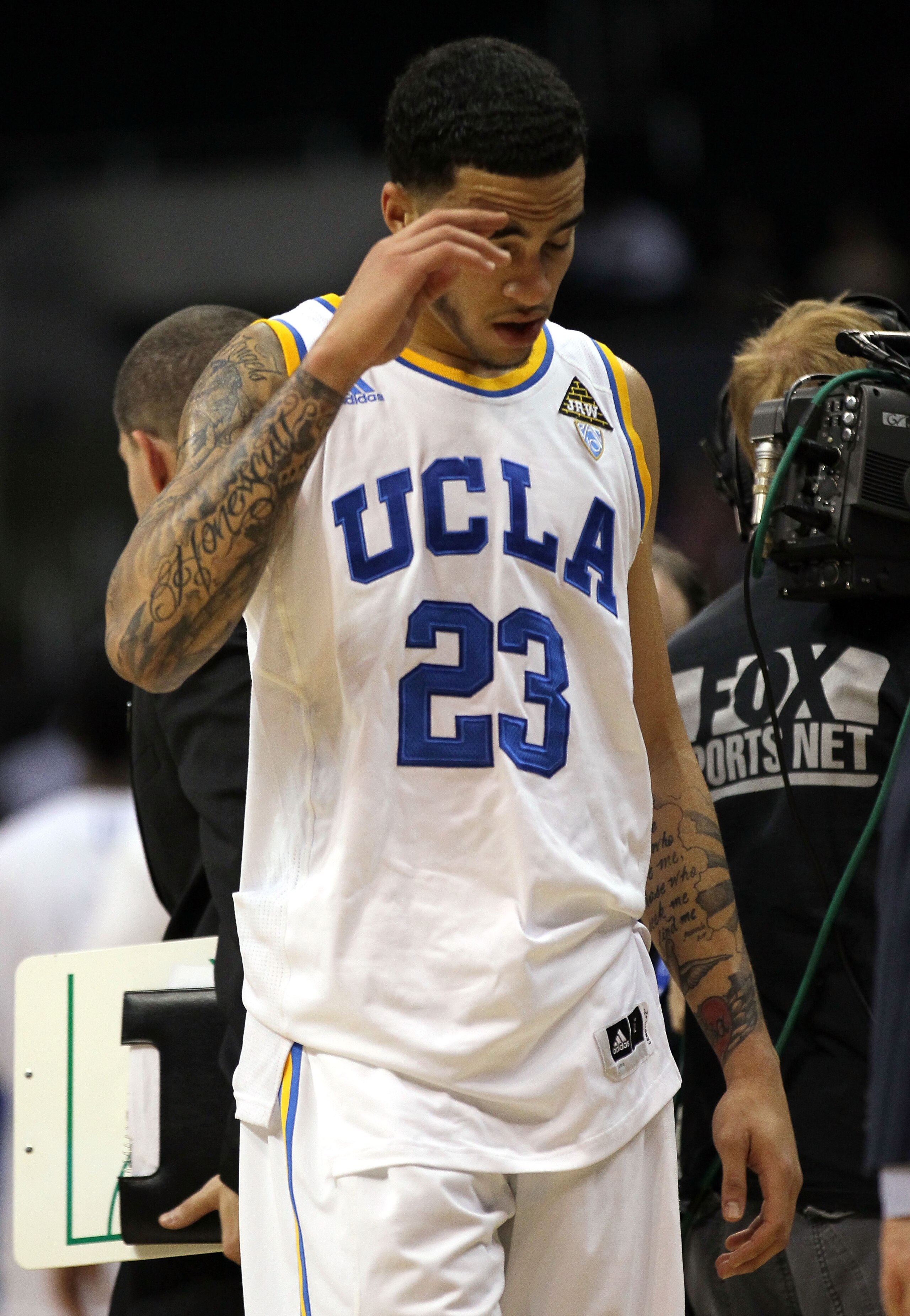 LOS ANGELES, CA - MARCH 10:  Tyler Honeycutt #23 of the UCLA Bruins walks off the court after the Bruins were defeated 76-59 by the Oregon Ducks in the quarterfinals of the 2011 Pacific Life Pac-10 Men's Basketball Tournament at Staples Center on March 10