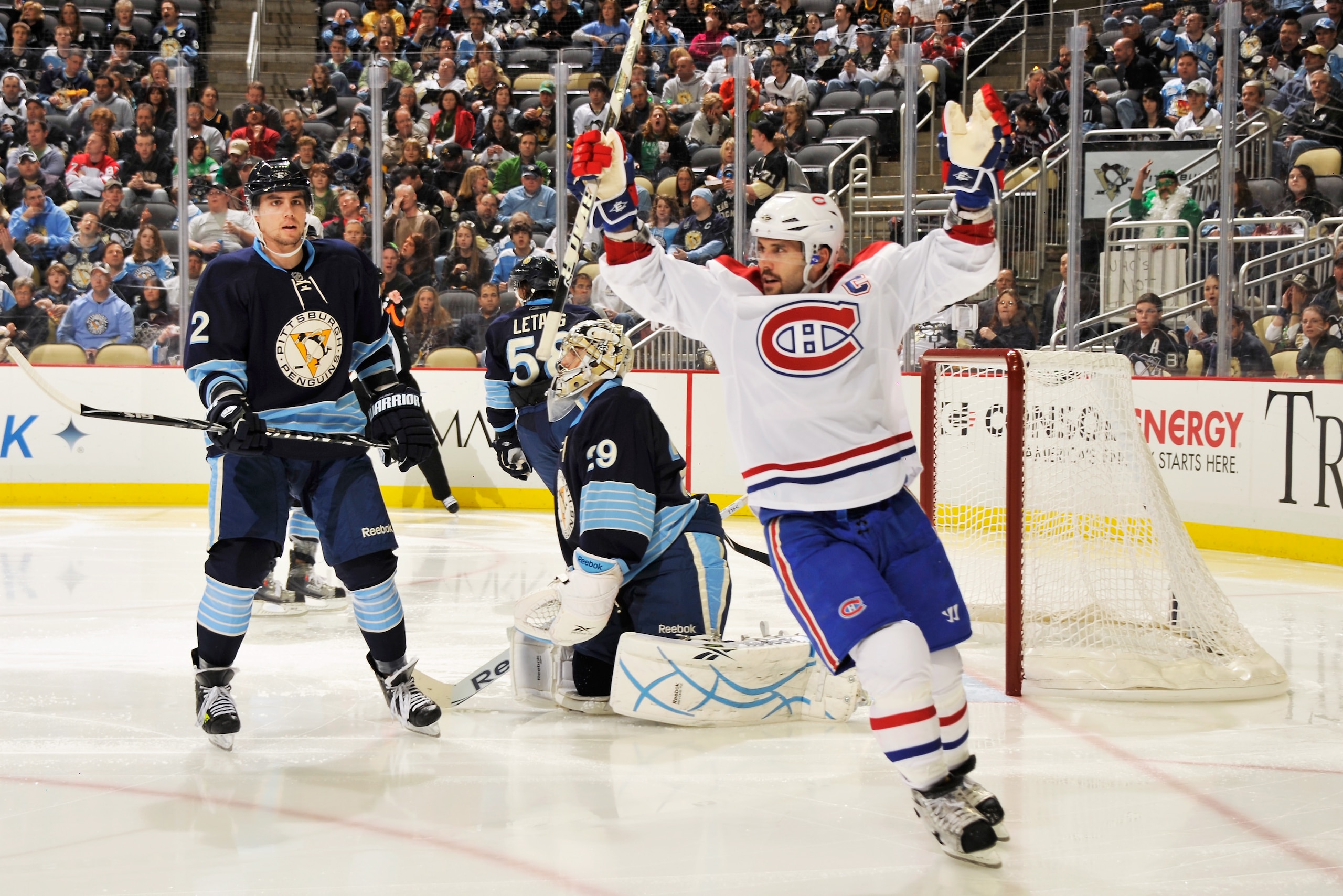 PITTSBURGH, PA - MARCH 12:  Brian Gionta #21 of the Montreal Canadiens celebrates a goal by teammate Travis Moen #32 of the Montreal Canadiens just 24 seconds into the second period against the Pittsburgh Penguins on March 12, 2011 at CONSOL Energy Center
