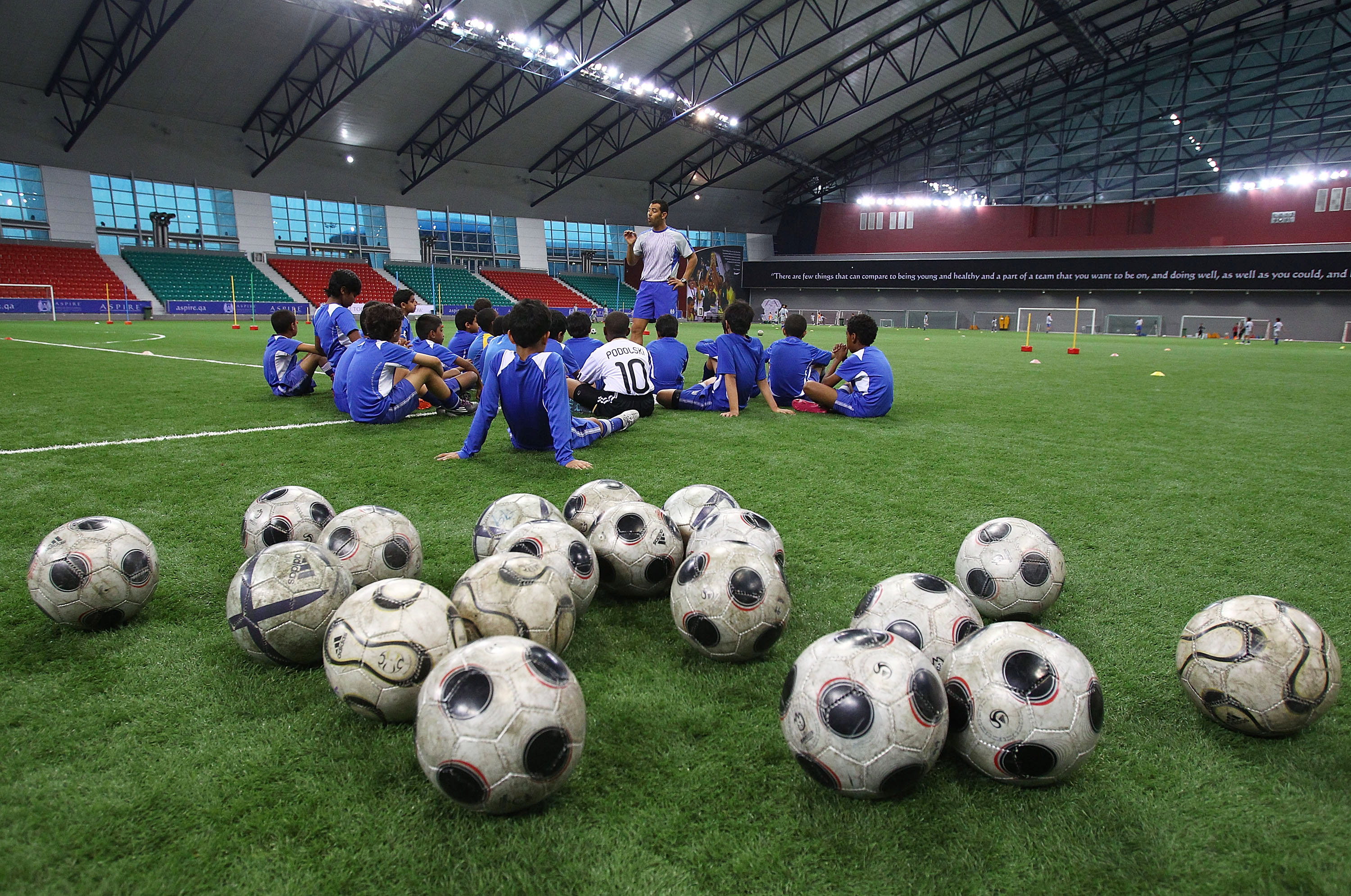 DOHA, QATAR - JANUARY 25:  Local children participate in a football training session at the ASPIRE Academy for Sports Excellence on January 25, 2011 in Doha, Qatar.  (Photo by Robert Cianflone/Getty Images)