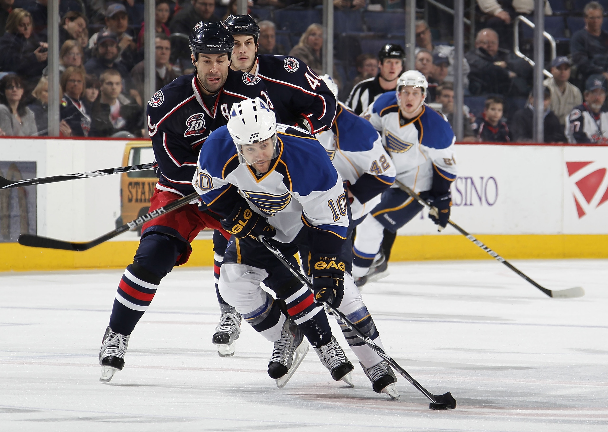 COLUMBUS, OH - MARCH 09:  Andy McDonald #10 of the St. Louis Blues heads up ice in front of Jared Boll #40 of the Columbus Blue Jackets on March 9, 2011 at Nationwide Arena in Columbus, Ohio.  (Photo by Gregory Shamus/Getty Images)