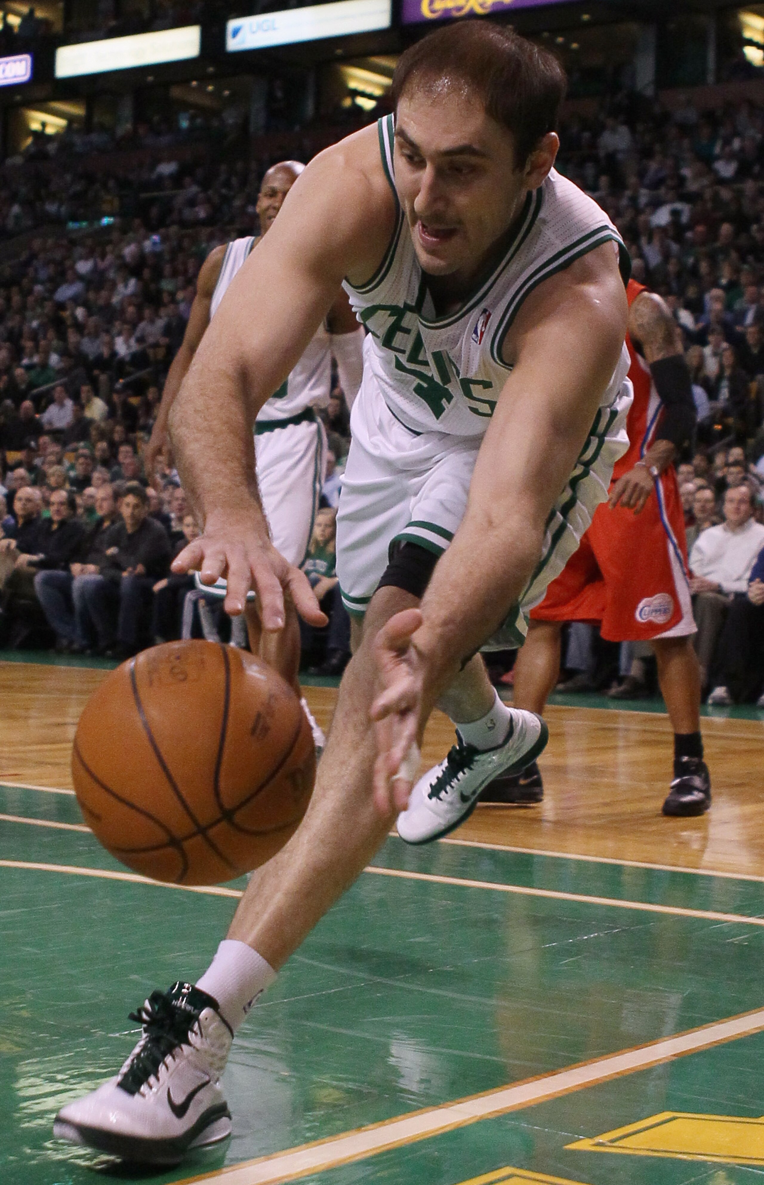 BOSTON, MA - MARCH 09: Nenad Krstic #4 of the Boston Celtics chases after a loose ball in the first half against the Los Angeles Clippers on March 9, 2011 at the TD Garden in Boston, Massachusetts. NOTE TO USER: User expressly acknowledges and agrees that