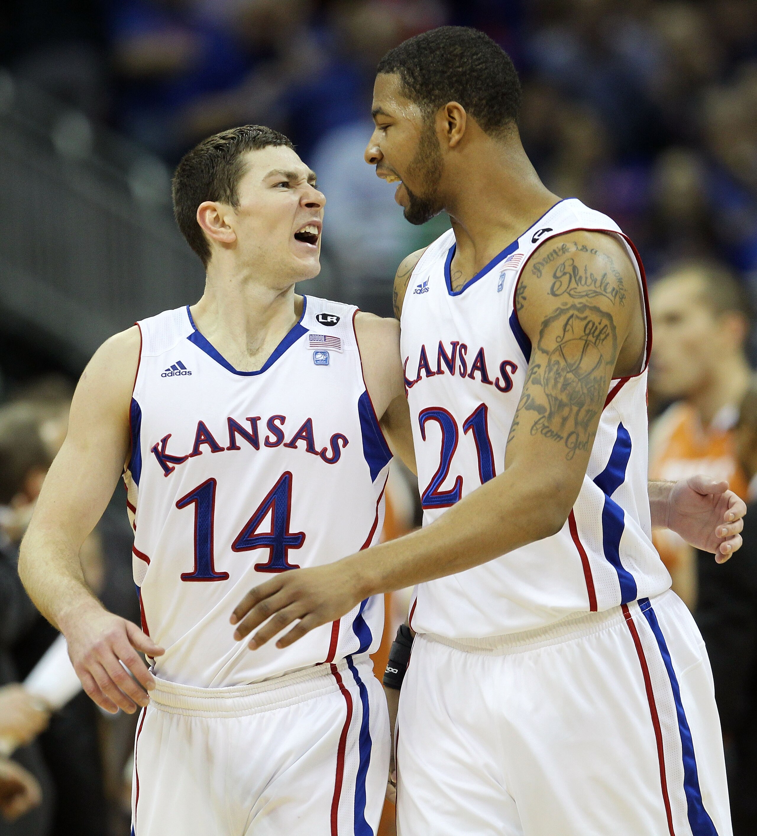 KANSAS CITY, MO - MARCH 12:  Tyrel Reed #14 and Markieff Morris #21 of the Kansas Jayhawks react to a play against the Texas Longhorns during the 2011 Phillips 66 Big 12 Men's Basketball Tournament championship game at Sprint Center on March 12, 2011 in K
