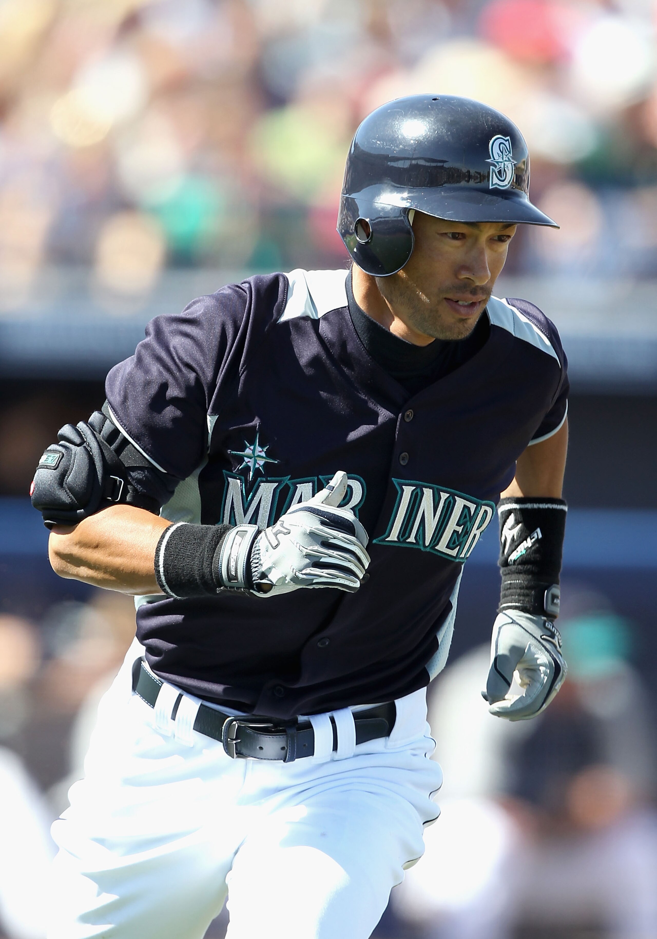 PEORIA, AZ - MARCH 12:  Ichiro Suzuki #51 of the Seattle Mariners runs to first base during the second inning of the spring training game against the Oakland Athletics at Peoria Stadium on March 12, 2011 in Peoria, Arizona.  (Photo by Christian Petersen/G