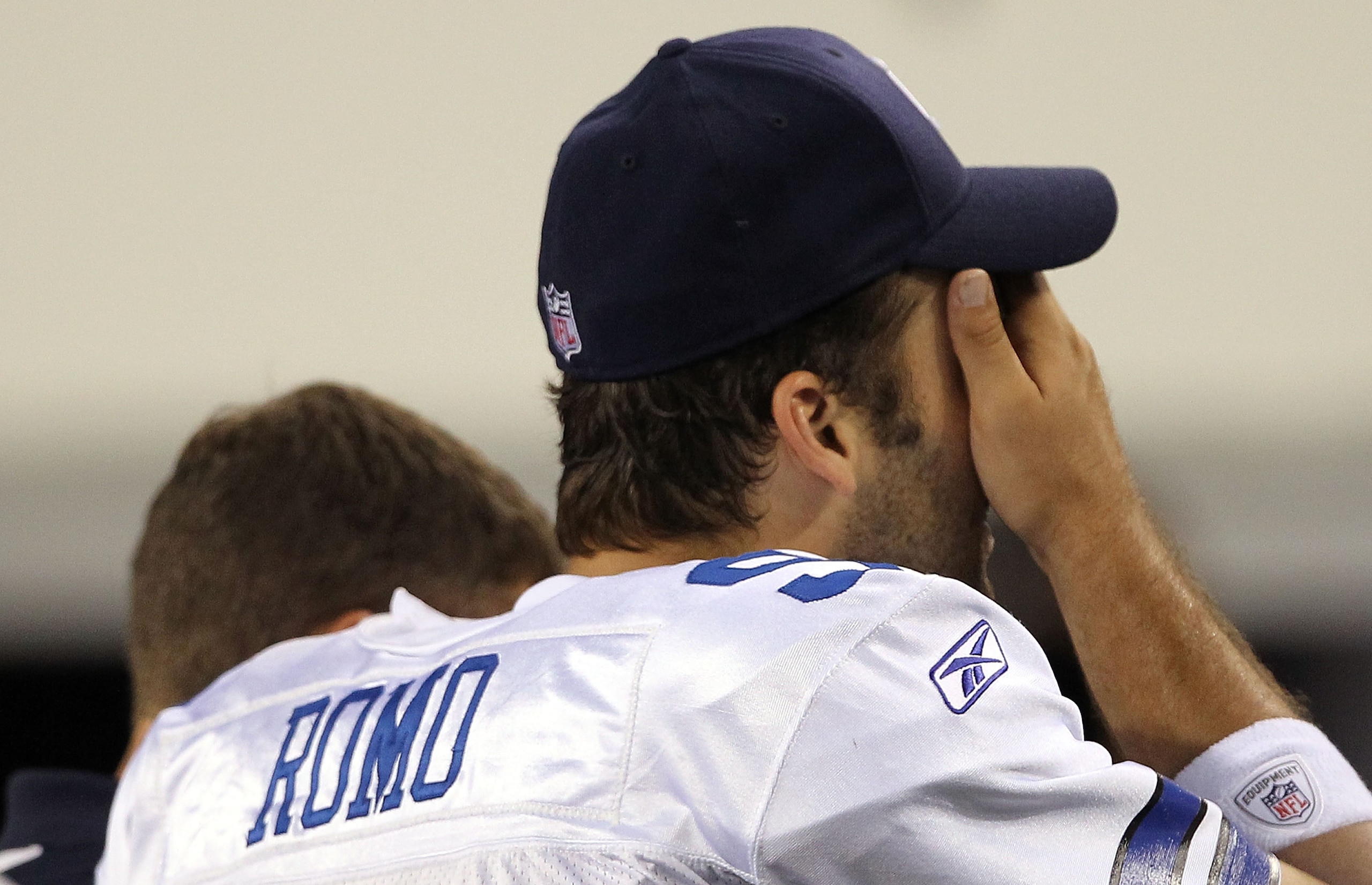 ARLINGTON, TX - OCTOBER 25:  Quarterback Tony Romo #9 of the Dallas Cowboys leaves the game after a left shoulder injury in the second quarter against the New York Giants at Cowboys Stadium on October 25, 2010 in Arlington, Texas.  (Photo by Ronald Martin