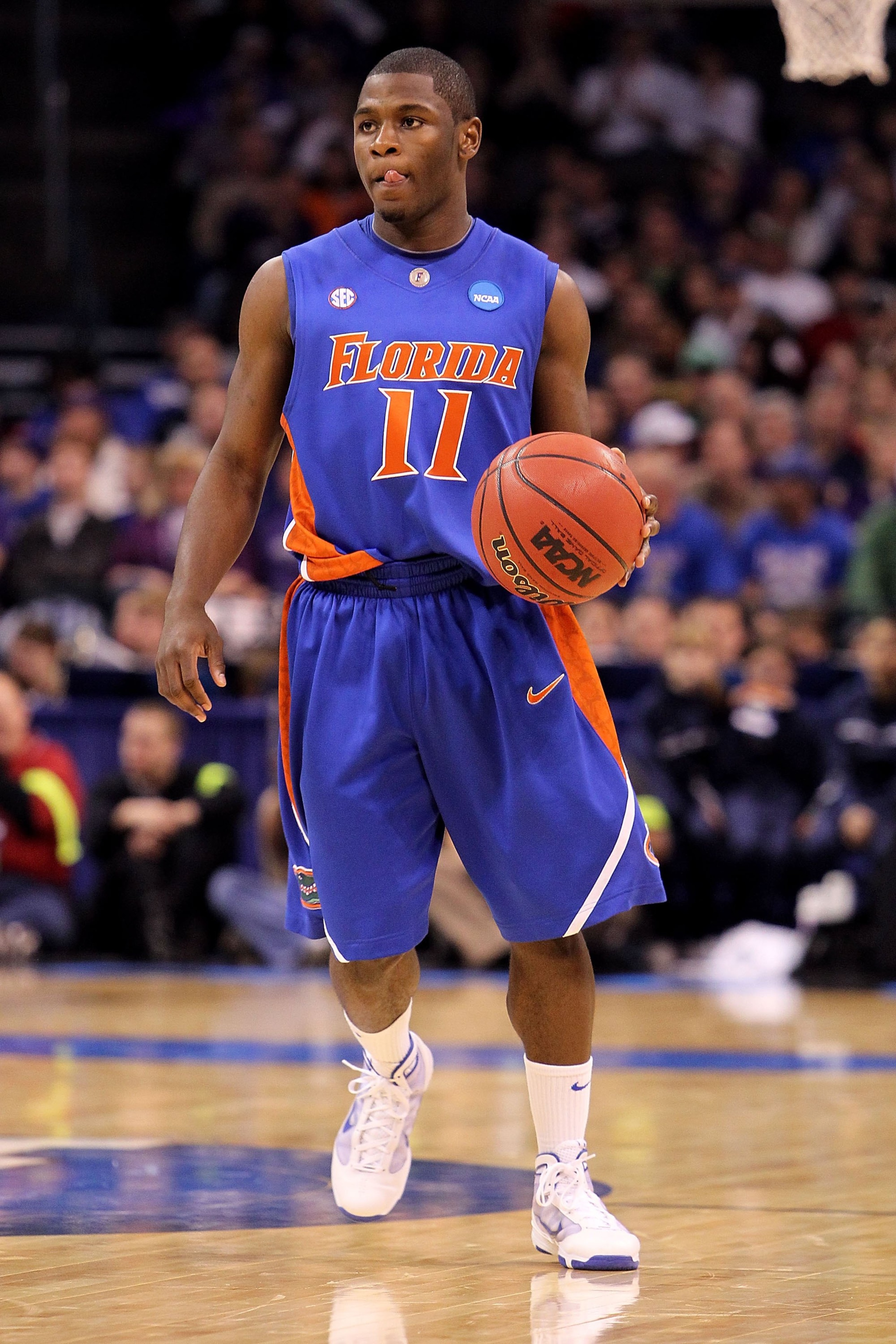 OKLAHOMA CITY - MARCH 18:  Erving Walker #11 of the Florida Gators handles the ball against the BYU Cougars during the first round of the 2010 NCAA menï¿½s basketball tournament at Ford Center on March 18, 2010 in Oklahoma City, Oklahoma. BYU won 99-92 in d