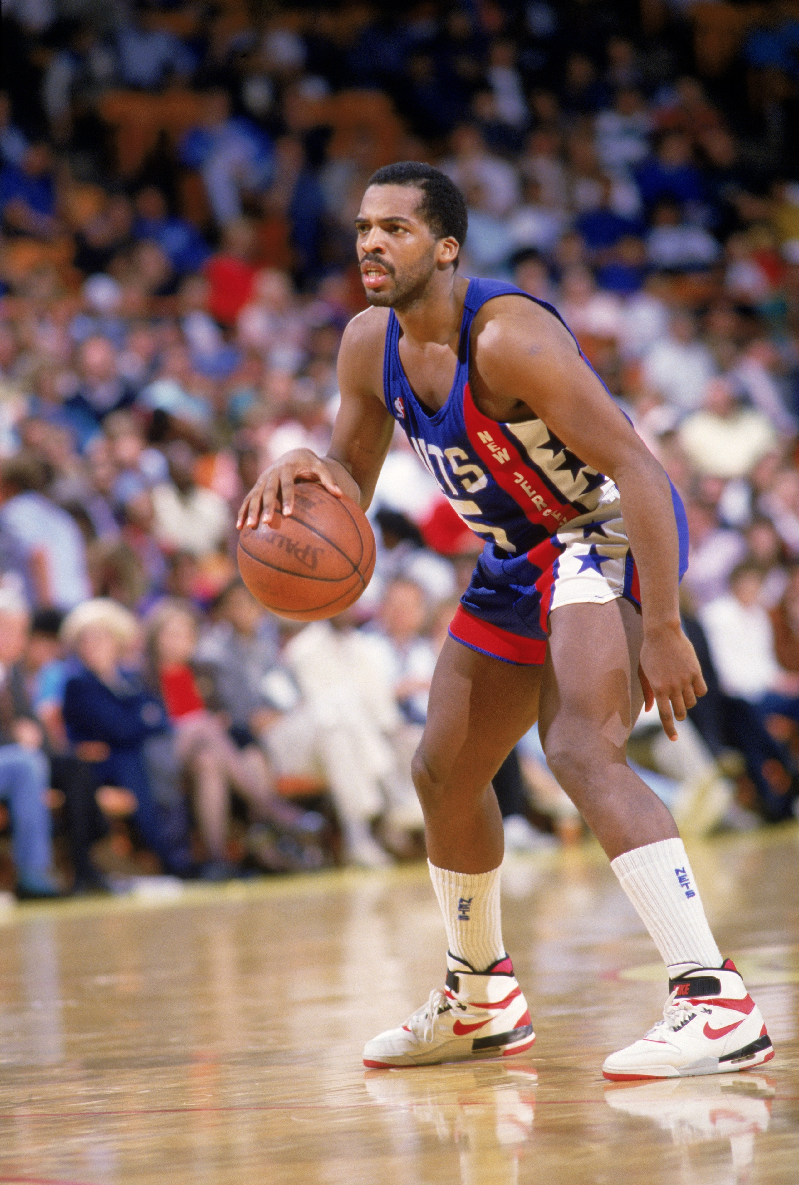 LOS ANGELES - 1988:  John Bagley #5 of the New Jersey Nets dribbles the ball at the perimeter during the NBA game against the Los Angeles Lakers at the Great Western Forum in Los Angeles, California in 1988. NOTE TO USER: User expressly acknowledges and a