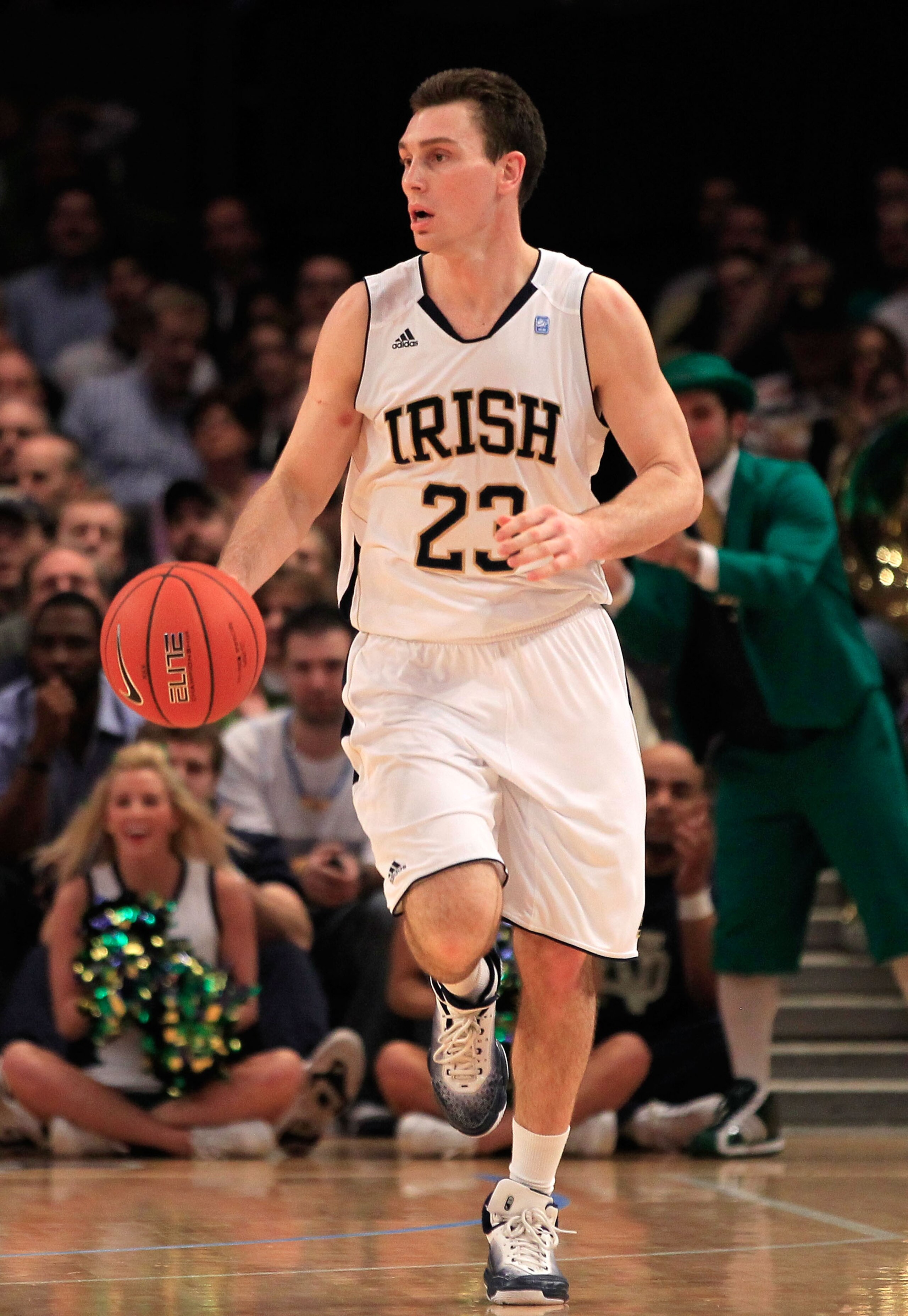NEW YORK, NY - MARCH 10: Ben Hansbrough #23 of the Notre Dame Fighting Irish brings the ball up court against the Cincinnati Bearcats during the quarterfinals of the 2011 Big East Men's Basketball Tournament presented by American Eagle Outfitters  at Madi