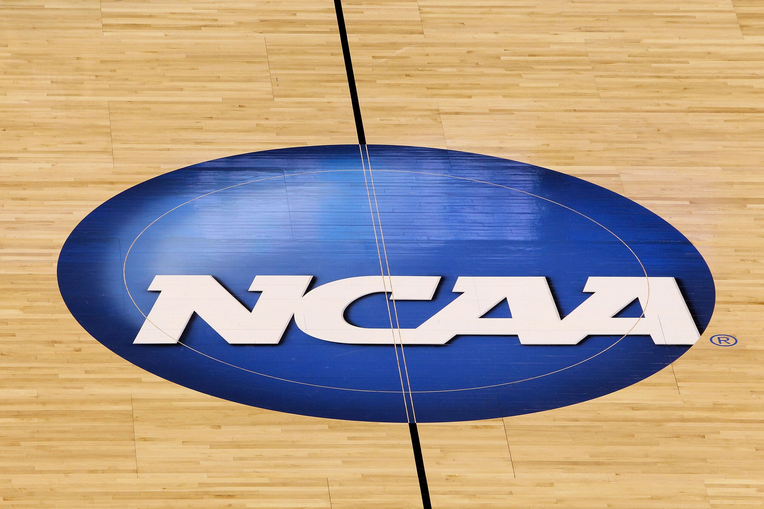 OKLAHOMA CITY - MARCH 20:  A detail of a NCAA logo  decal is seen at center court as the Kansas State Wildcats play against the Brigham Young Cougars during the second round of the 2010 NCAA men's basketball tournament at Ford Center on March 20, 2010 in 