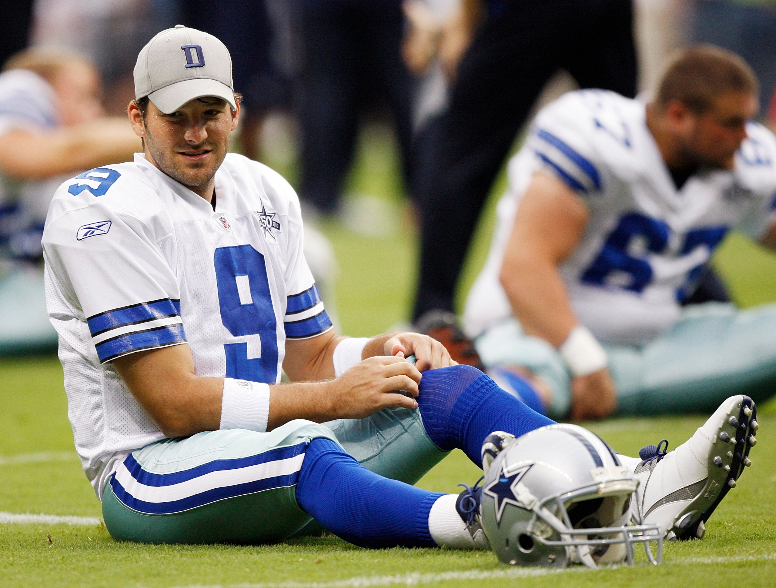 HOUSTON - AUGUST 28:  Quarterback Tony Romo #9 of the Dallas Cowboys warmups before playing the Houston Texans in a preseason game at Reliant Stadium on August 28, 2010 in Houston, Texas.  (Photo by Bob Levey/Getty Images)