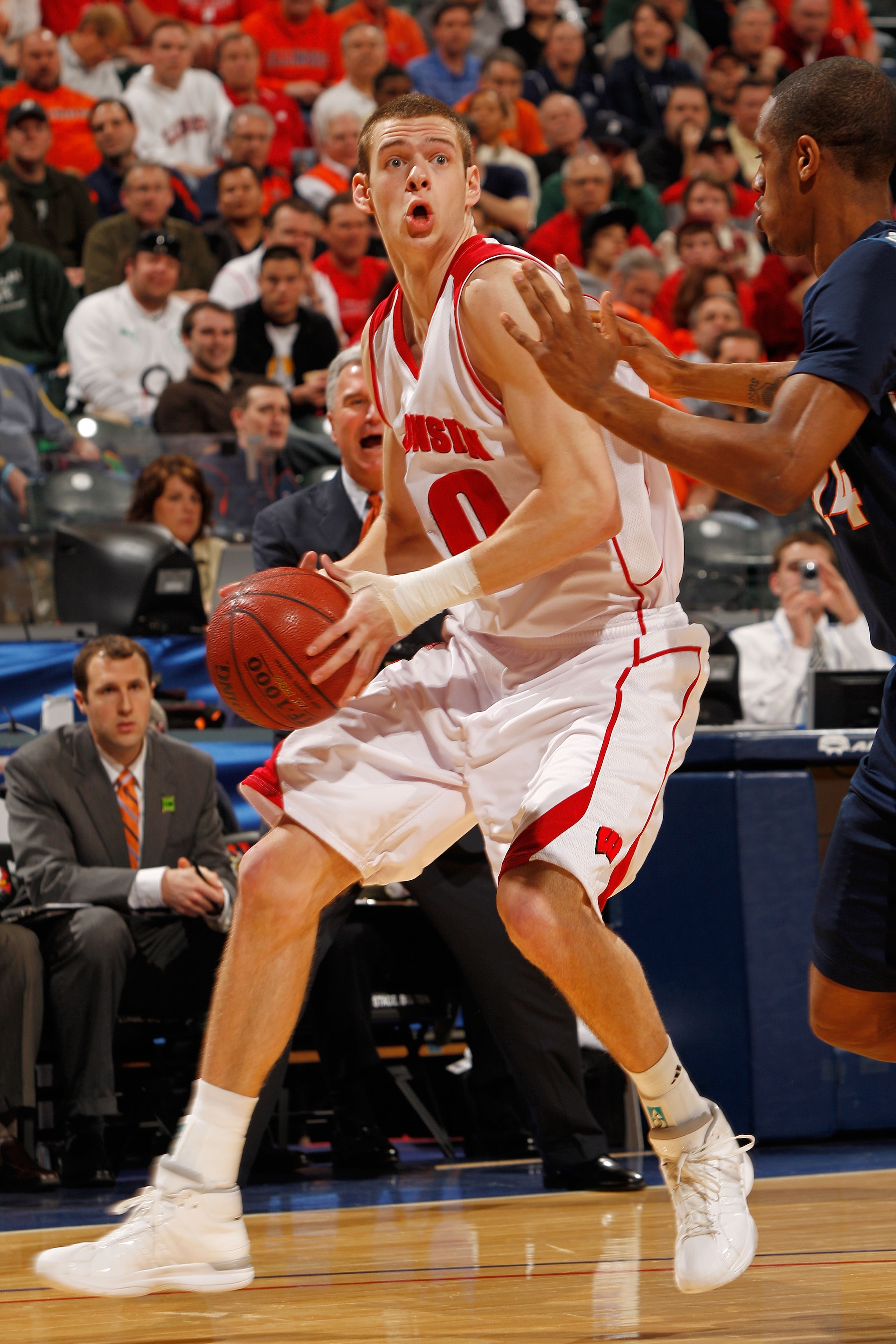 INDIANAPOLIS - MARCH 12:  Forward Jon Leuer #30 of the Wisconsin Badgers drives with the ball against the Illinois Fighting Illini during the quarterfinals of the Big Ten Men's Basketball Tournament at Conseco Fieldhouse on March 12, 2010 in Indianapolis,