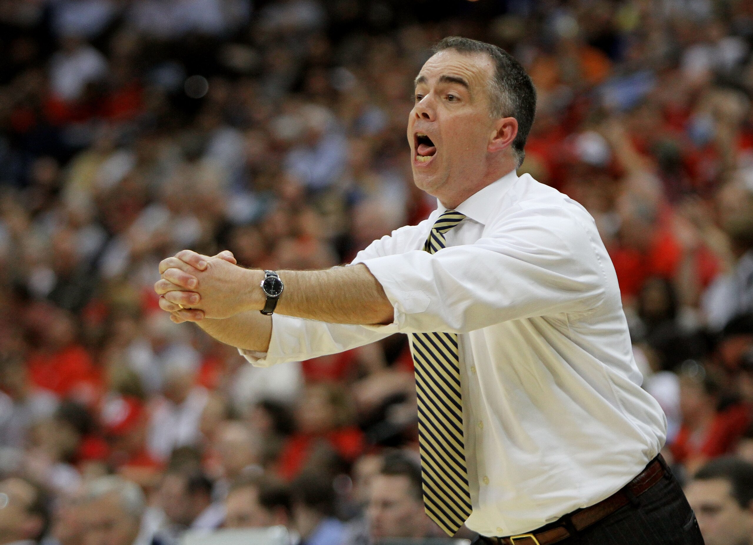 JACKSONVILLE, FL - MARCH 19:  Mike Young head coach of the Wofford Terriers yells out to his team while facing the Wisconsin Badgers during the first round of the 2010 NCAA men's basketball tournament at Jacksonville Veteran's Memorial Arena on March 19,