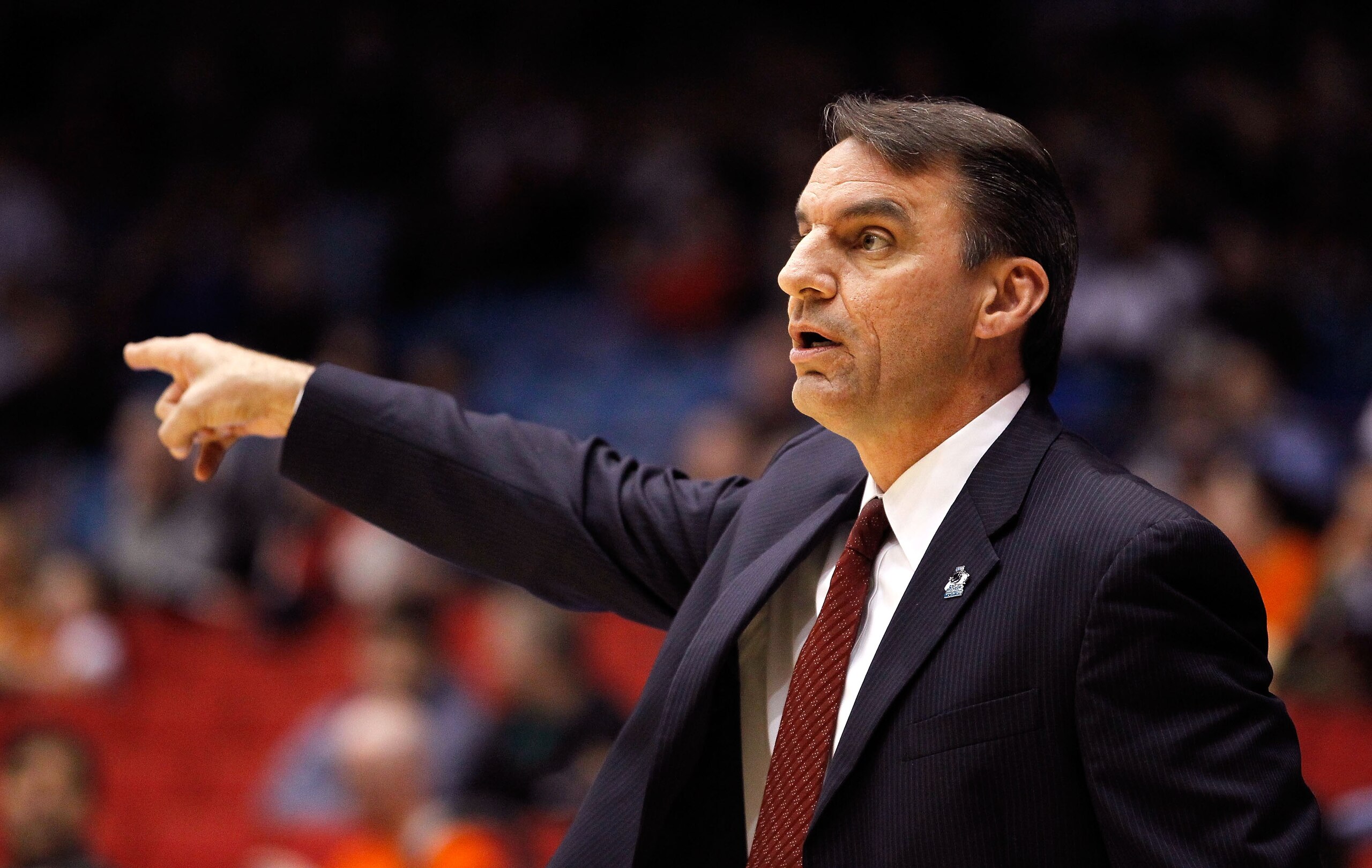 DAYTON, OH - MARCH 15: Head coach Steve Shields of the Arkansas Little Rock Trojans gestures from the bench during the game against the North Carolina-Asheville Bulldogs during the first round of the 2011 NCAA men's basketball tournament at UD Arena on Ma