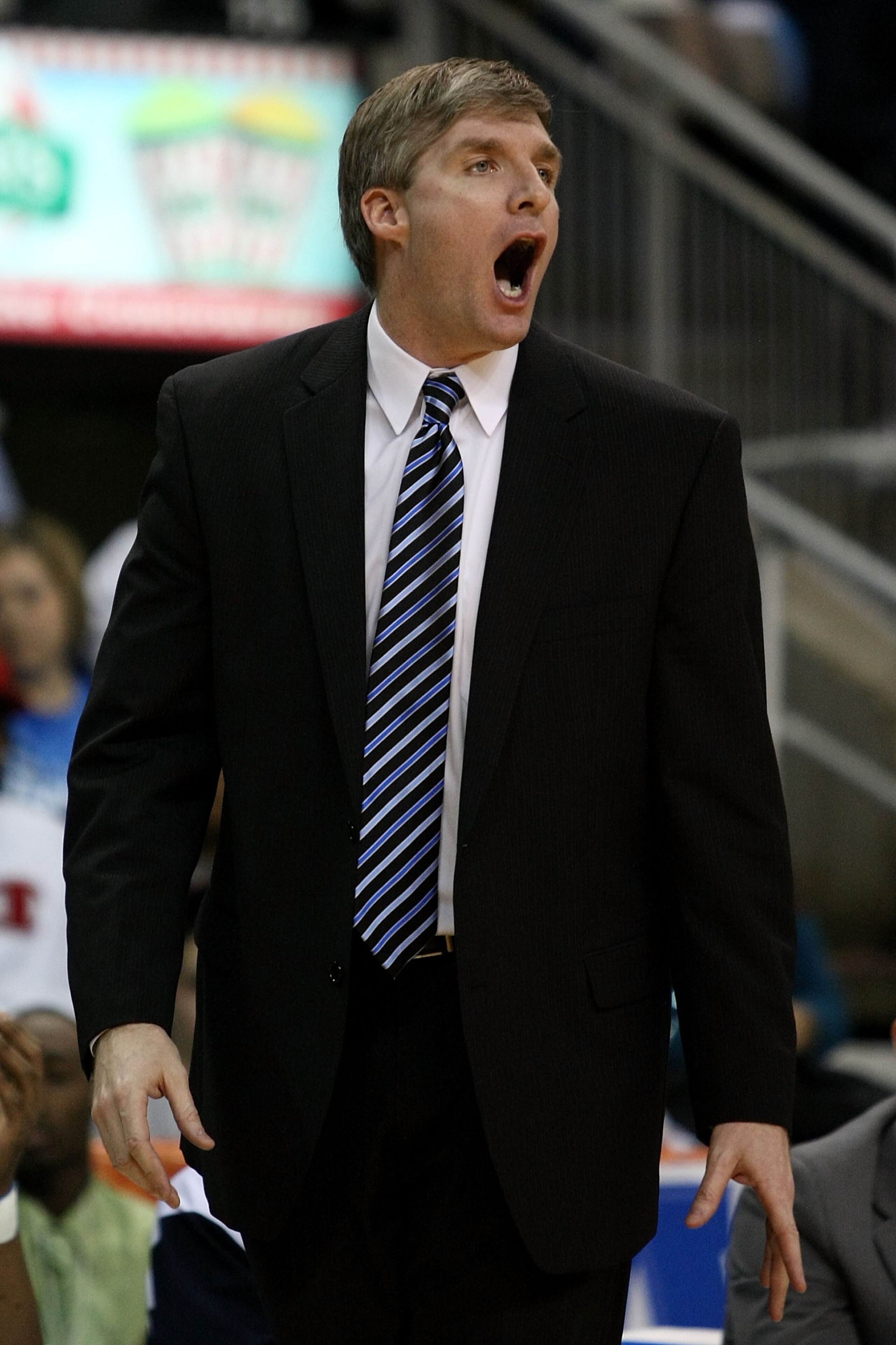 BRIDGEPORT, CT - MARCH 07:  Head coach John Dunne of the St. Peter's Peacocks reacts as he coaches against the Iona Gaelsduring the final of the MAAC men's conference basketball tournment at Webster Bank Arena at Harbor Yard on March 7, 2011 in Bridgeport