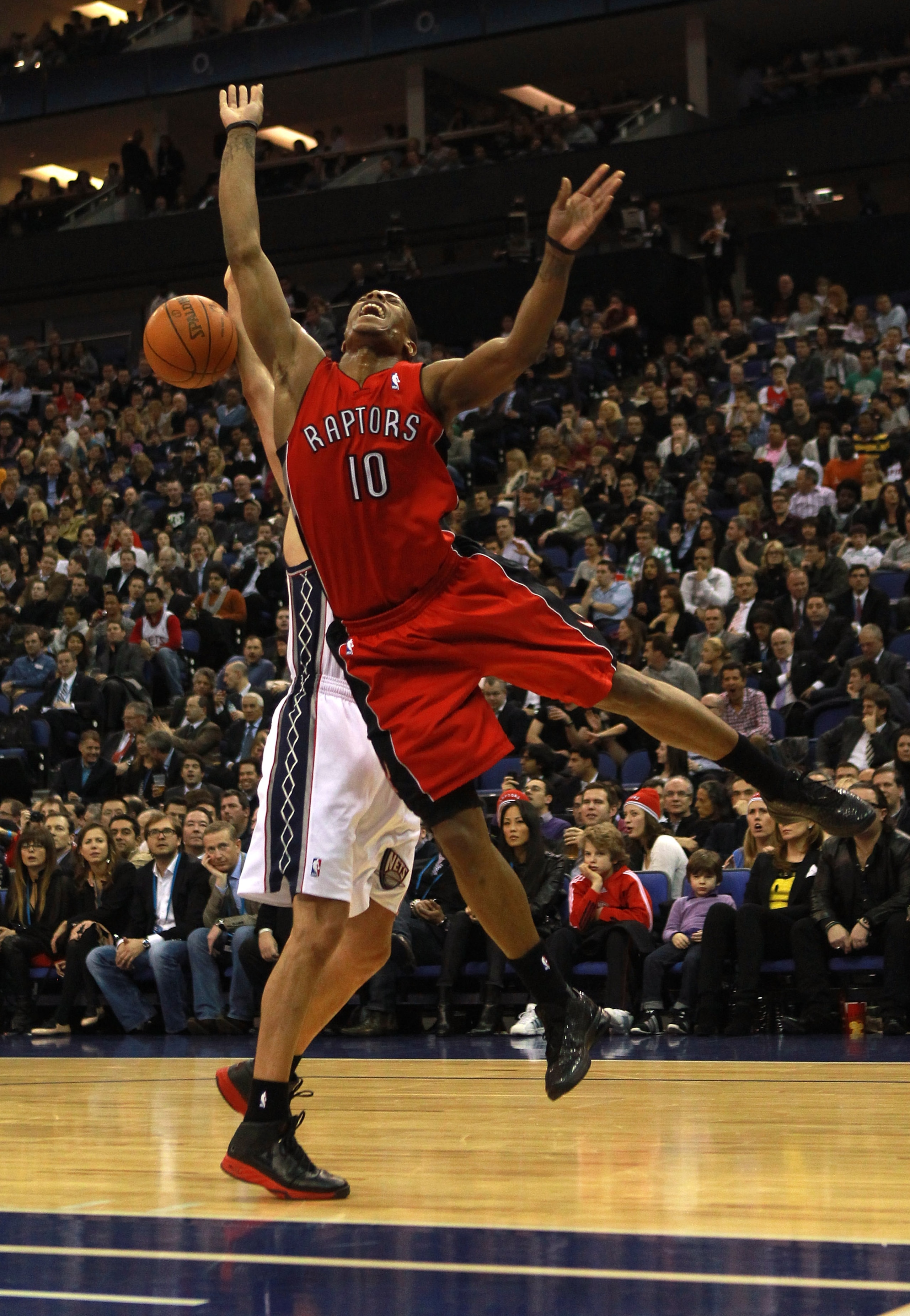 LONDON, ENGLAND - MARCH 04:  #10 DeMar DeRozan of the Raptors jumps to defence a shot at goal during the NBA match between New Jersey Nets and the Toronto Raptors at the O2 Arena on March 4, 2011 in London, England. NOTE TO USER: User expressly acknowledg