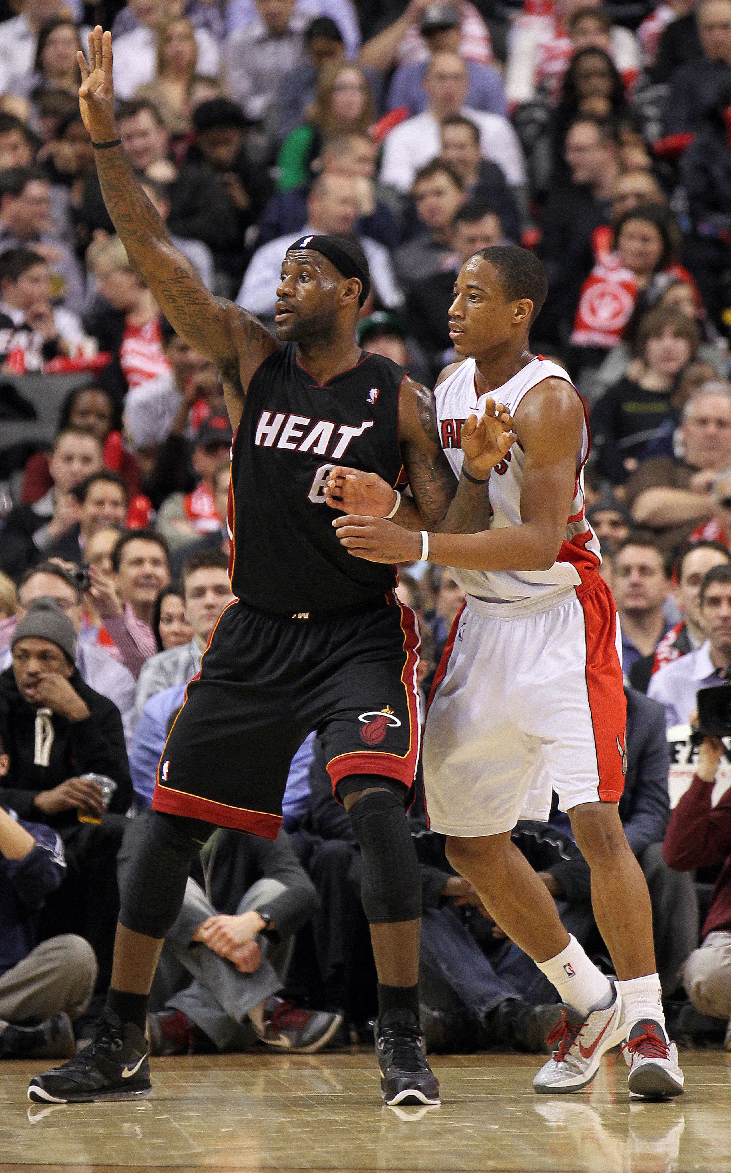 TORONTO, CANADA - FEBRUARY 16:  LeBron James #6 of the Miami Heat calls for a ball while being defended by DeMar DeRozan #10 of the Toronto Raptors in a game on February 16, 2011 at the Air Canada Centre in Toronto, Canada. The Heat defeated the Raptors 1