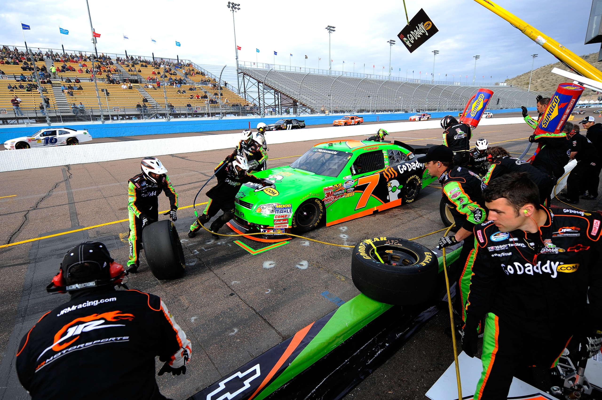 AVONDALE, AZ - FEBRUARY 26:  Danica Patrick, driver of the #7 GoDaddy.com Chevrolet, makes a pit stop during the NASCAR Nationwide Series Bashas' Supermarkets 200 at Phoenix International Raceway on February 26, 2011 in Avondale, Arizona.  (Photo by Jared