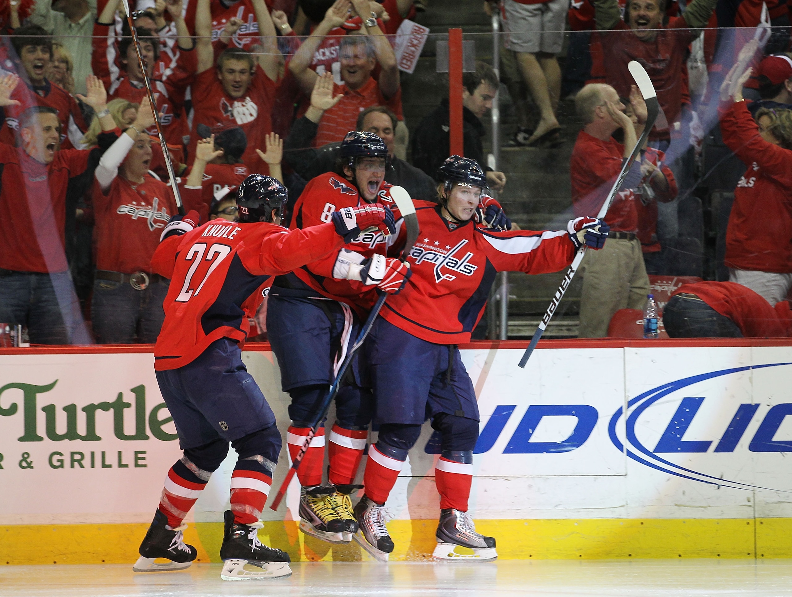 WASHINGTON - APRIL 17: Nicklas Backstrom #19 (R) of the Washington Capitals scores in overtime and is joined by Mike Knuble #22 (L) and Alex Ovechkin #8 (C) to defeat the Montreal Canadiens 6-5  in Game Two of the Eastern Conference Quarterfinals during t