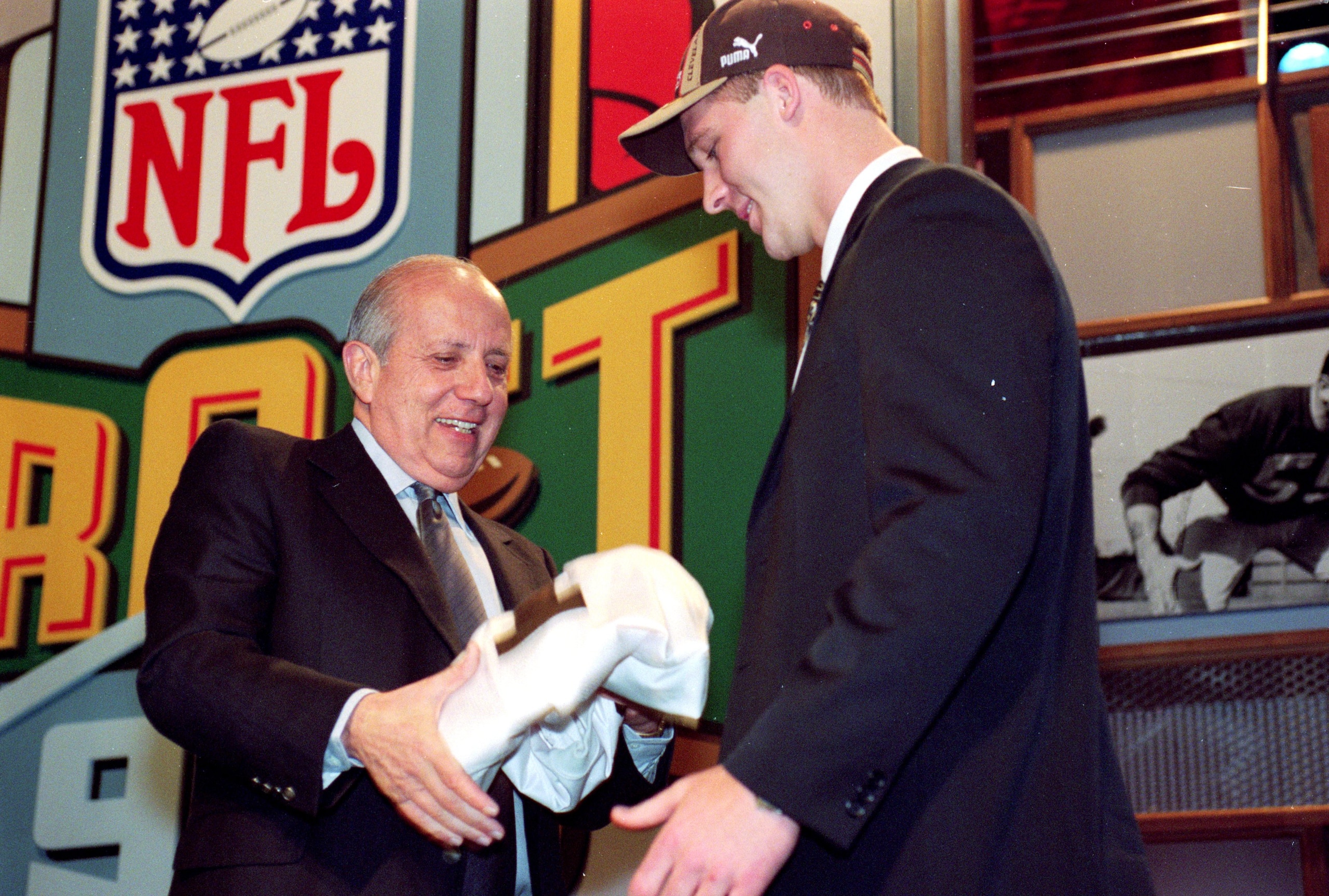 17 Apr 1999:  #1 pick Tim Couch of the Cleveland Browns is handed a Browns jersey during the NFL Draft at Madison Square Garden in New York, New York. Mandatory Credit: Ezra O. Shaw  /Allsport
