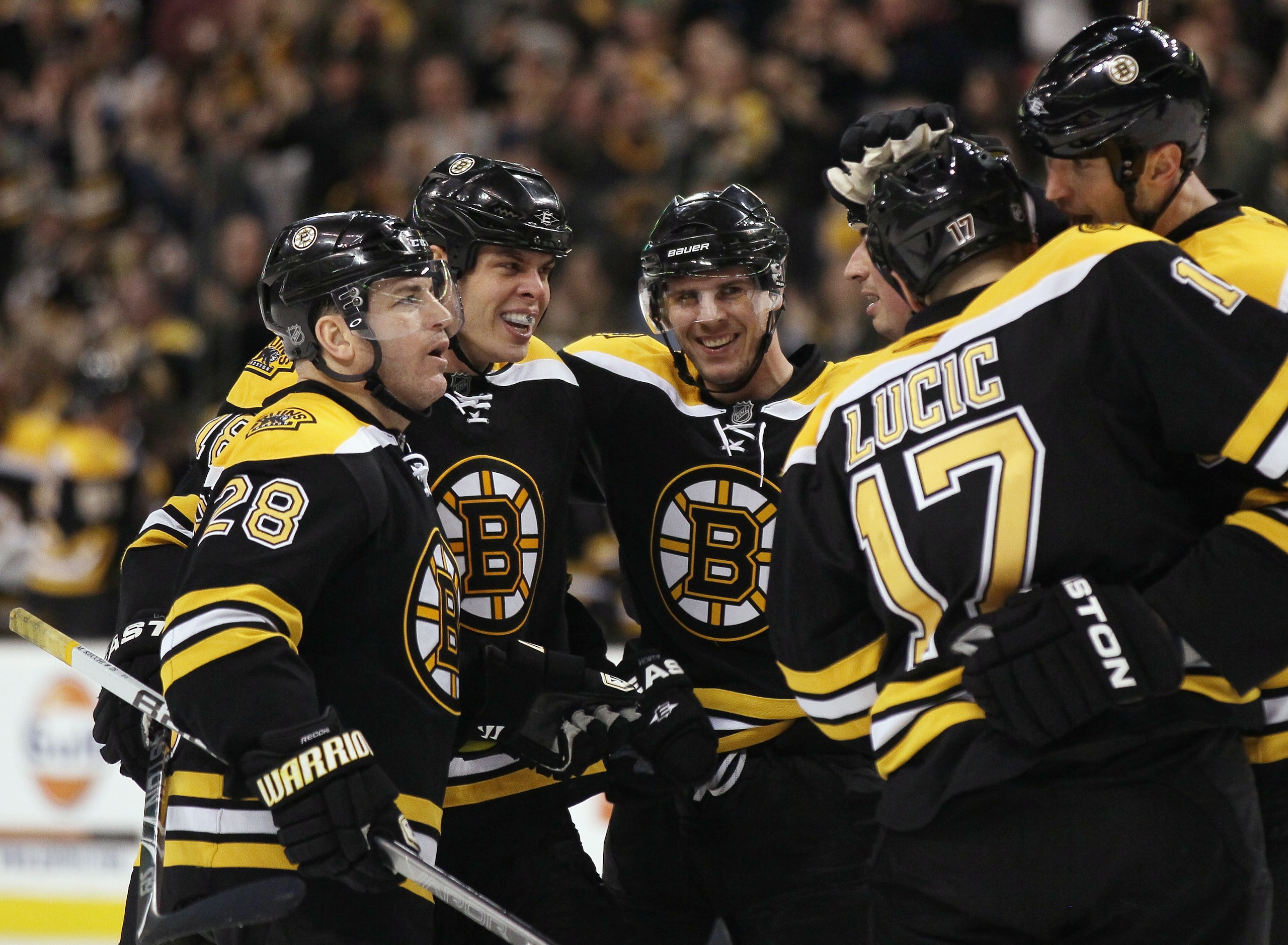 BOSTON, MA - MARCH 05:  David Krejci #46 of the Boston Bruins is congratulated by teammates Mark Recchi #28,Nathan Horton #18,Milan Lucic #17 and Zdeno Chara #33 after Krejci scored a goal in the final minute of the game to send it into overtime against t