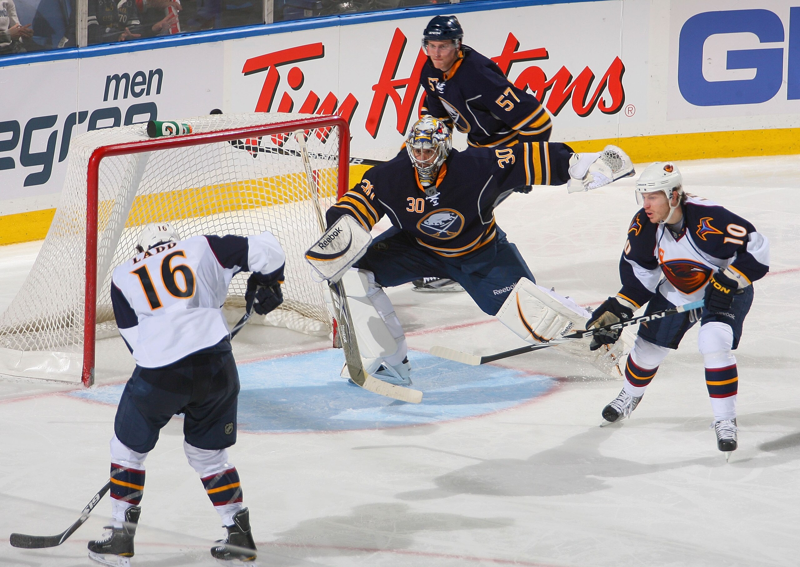 BUFFALO, NY - FEBRUARY 23: Ryan Miller #30 and Tyler Myers #57 of the Buffalo Sabres defend    against Andrew Ladd #16 and Brian Little #10 of the Atlanta Thrashers at HSBC Arena on February 23, 2011 in Buffalo, New York. Buffalo won 4-1.  (Photo by Rick