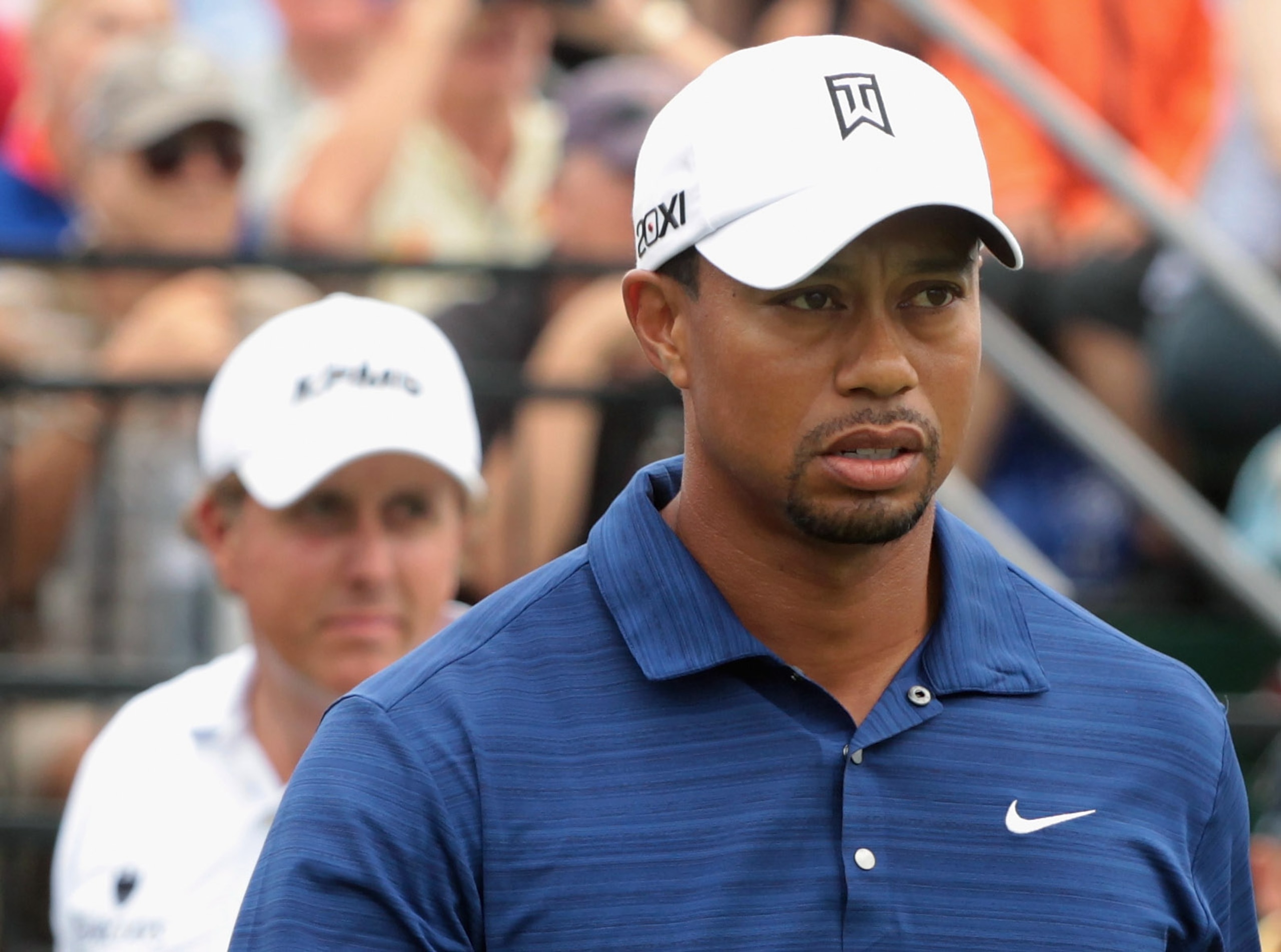 DORAL, FL - MARCH 10:  Tiger Woods (R) and Phil Mickelson walk off the tenth tee during the first round of the 2011 WGC- Cadillac Championship at the TPC Blue Monster at the Doral Golf Resort and Spa on March 10, 2011 in Doral, Florida.  (Photo by Scott H