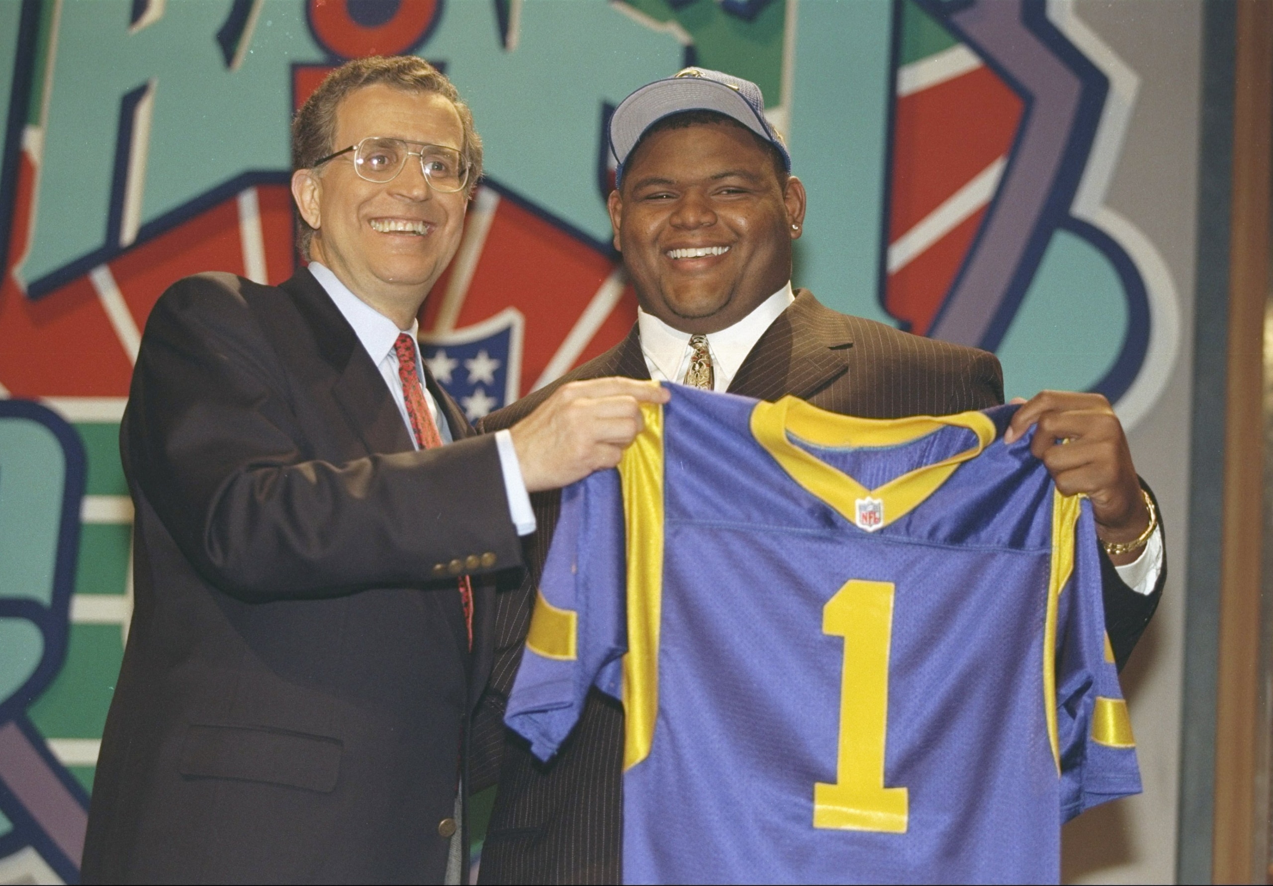 19 Apr 1997:  Offensive tackle Orlando Pace of the Ohio State Buckeyes holds jersey of the St. Louis Rams at the NFL Draft at Paramount Studios in Manhattan, New York.  Pace was the number one pick. Mandatory Credit: Al Bello  /Allsport