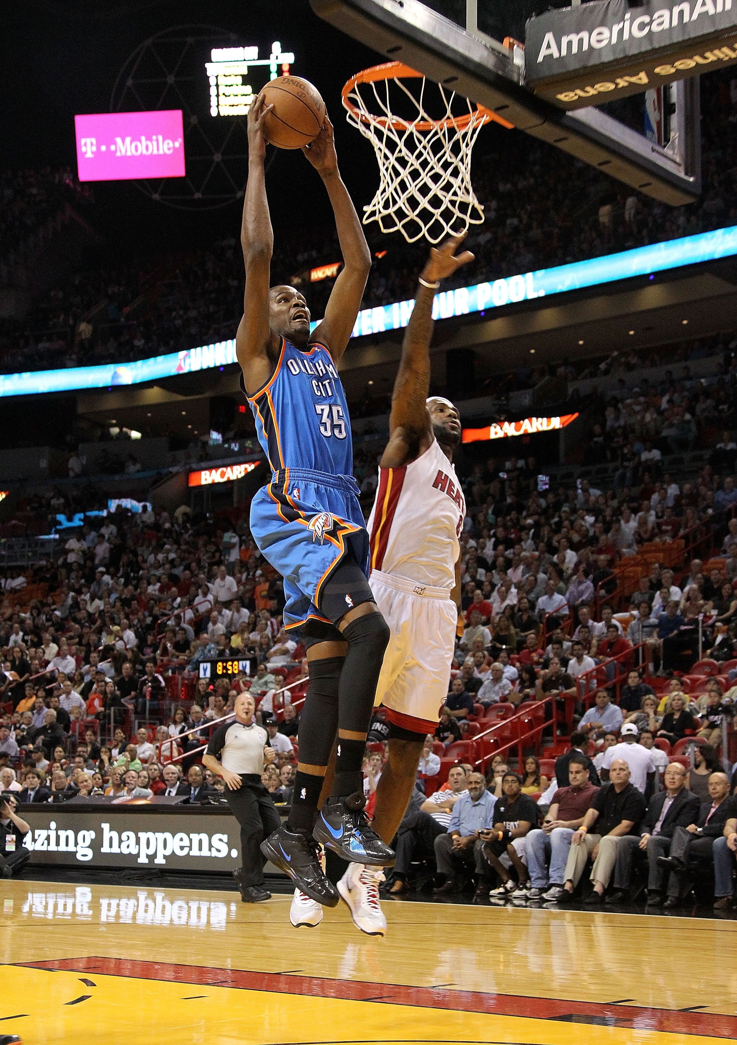 MIAMI, FL - MARCH 16: Kevin Durant #35  of the the Oklahoma City Thunder dunks over LeBron James #6 of the Miami Heat during a game at American Airlines Arena on March 16, 2011 in Miami, Florida. NOTE TO USER: User expressly acknowledges and agrees that,