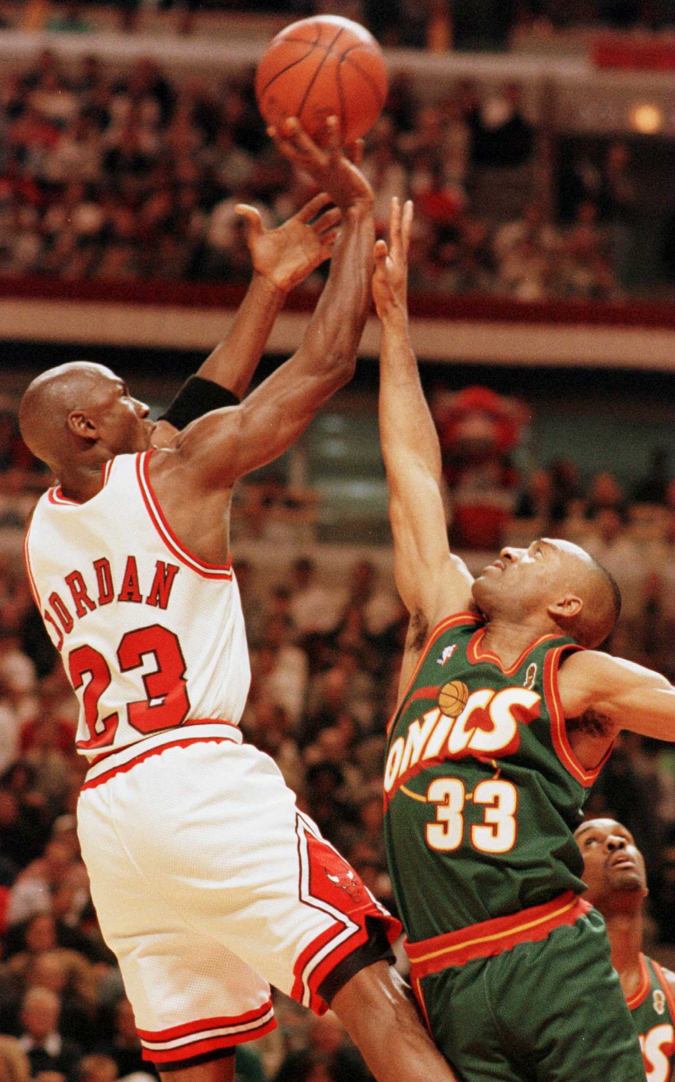 7 Jun 1996:   Michael Jordan #23 of the Chicago Bulls puts up a shot over Hersey Hawkins #33 of the Seattle Supersonics during  third quarter action of game two of the NBA Finals at the United Center in Chicago, Illinois. The Bulls went on to defeat the S