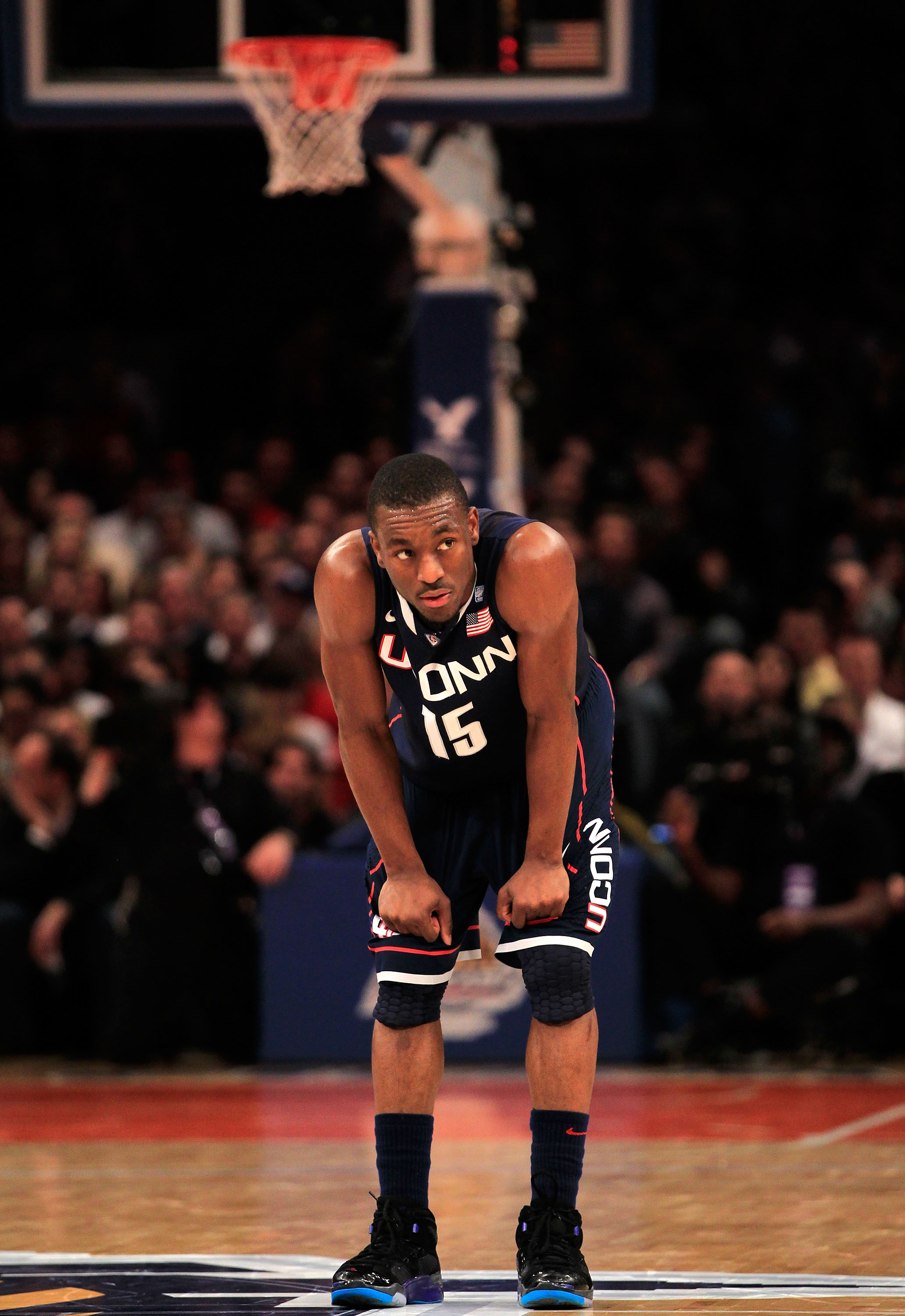 NEW YORK, NY - MARCH 12: Kemba Walker #15 of the Connecticut Huskies looks on after a play during the second half against the Louisville Cardinals during the championship of the 2011 Big East Men's Basketball Tournament presented by American Eagle Outfitt