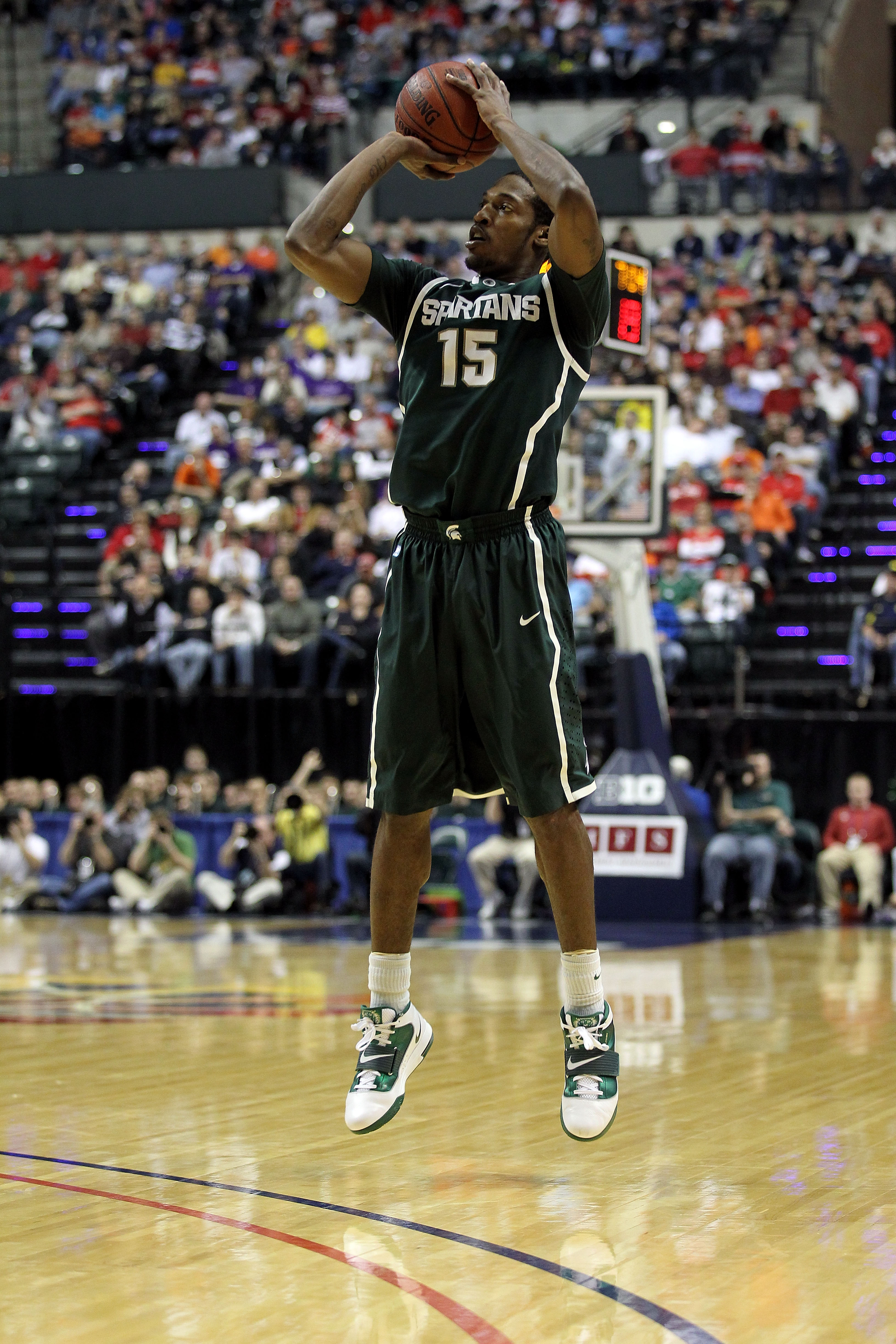 INDIANAPOLIS, IN - MARCH 12:  Durrell Summers #15 of the Michigan State Spartans attempts a shot against the Penn State Nittany Lions during the semifinals of the 2011 Big Ten Men's Basketball Tournament at Conseco Fieldhouse on March 12, 2011 in Indianap