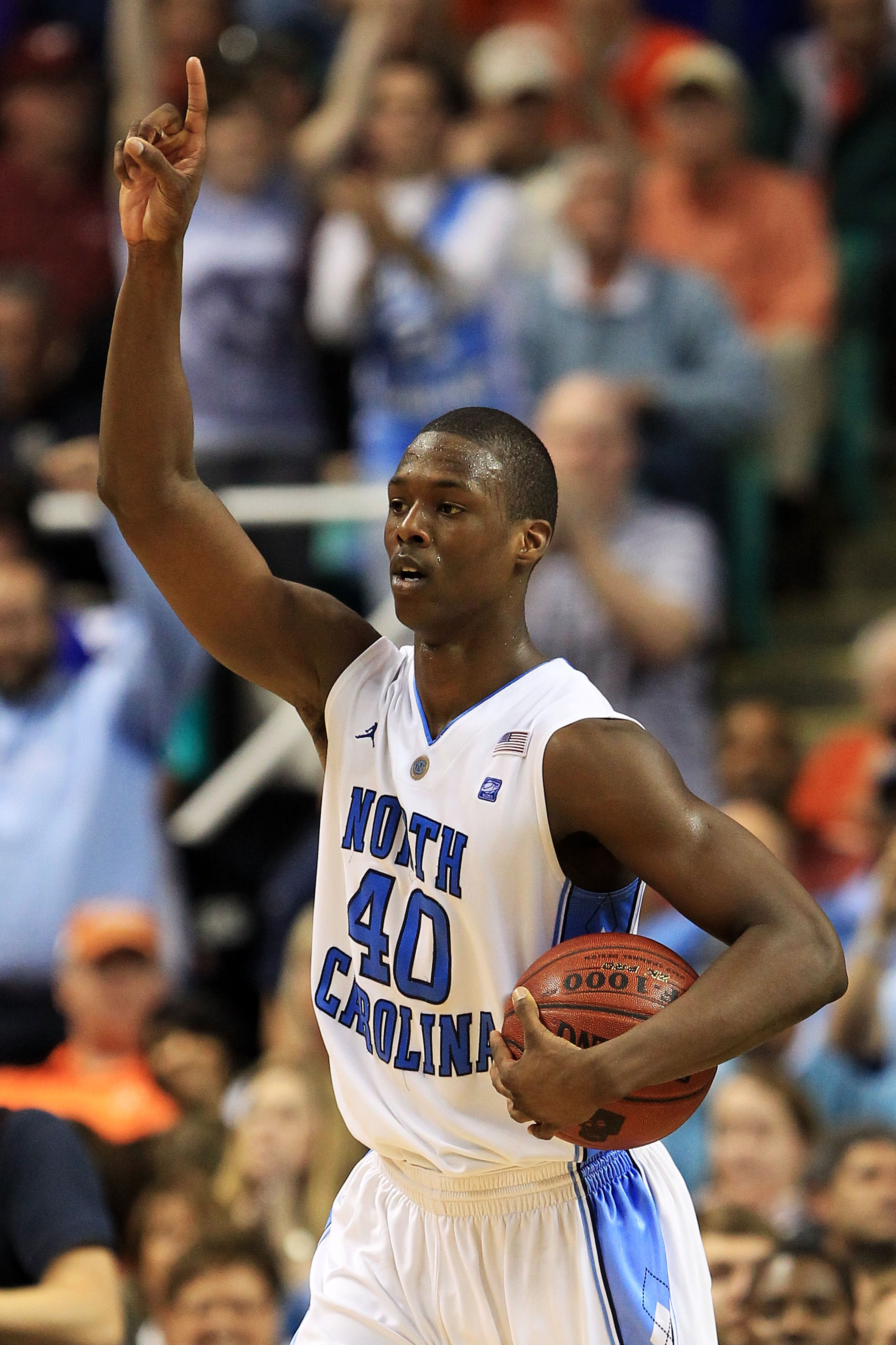GREENSBORO, NC - MARCH 12:  Harrison Barnes #40 of the North Carolina Tar Heels celebrates their 92-87 win over the Clemson Tigers during overtime in the semifinals of the 2011 ACC men's basketball tournament at the Greensboro Coliseum on March 12, 2011 i
