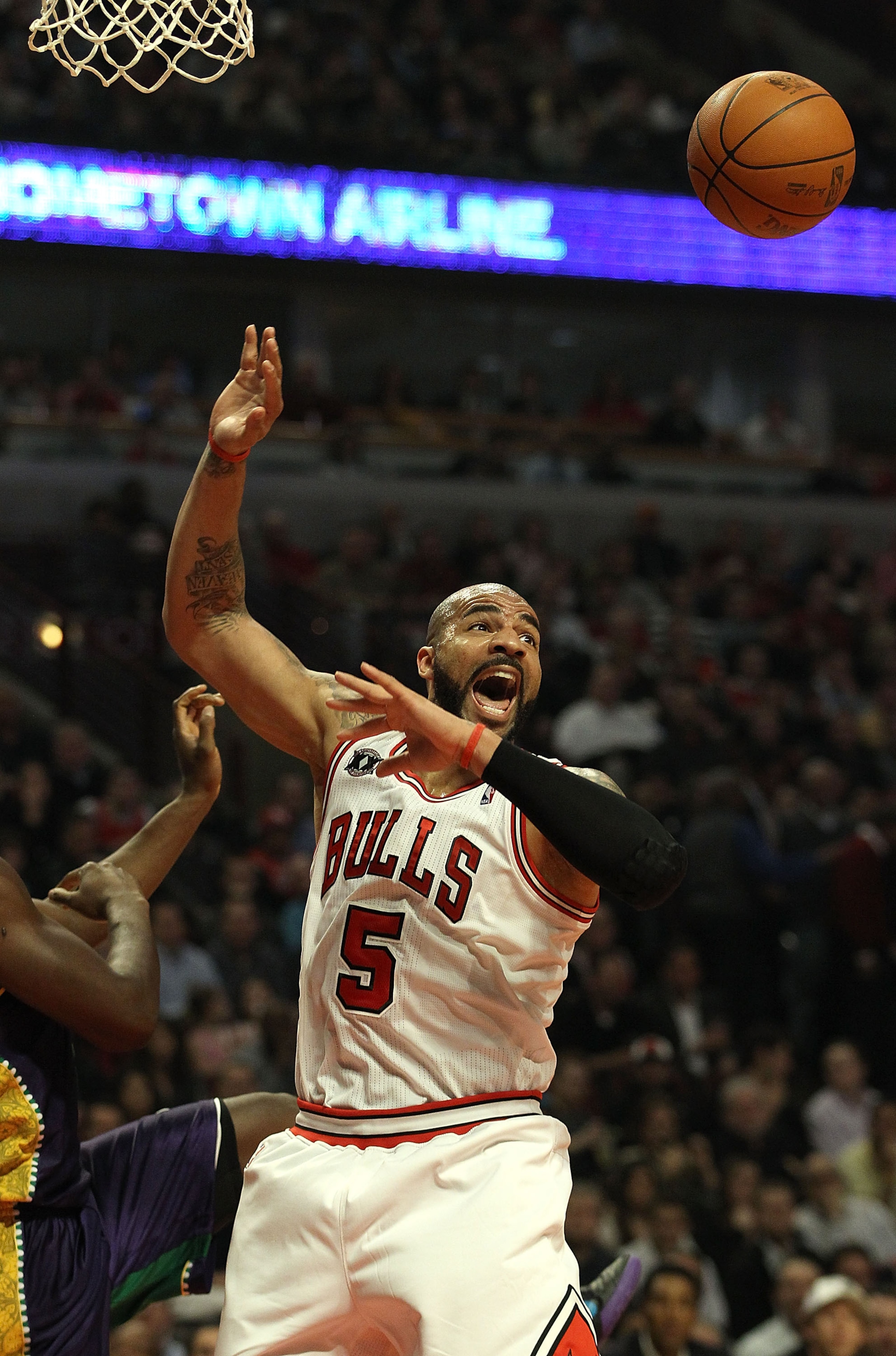 CHICAGO, IL - MARCH 07: Carlos Boozer #5 of the Chicago Bulls looses the ball after grabbing a rebound against the New Orleans Hornets at the United Center on March 7, 2011 in Chicago, Illinois. The Bulls defeated the Hornets 85-77. NOTE TO USER: User exp