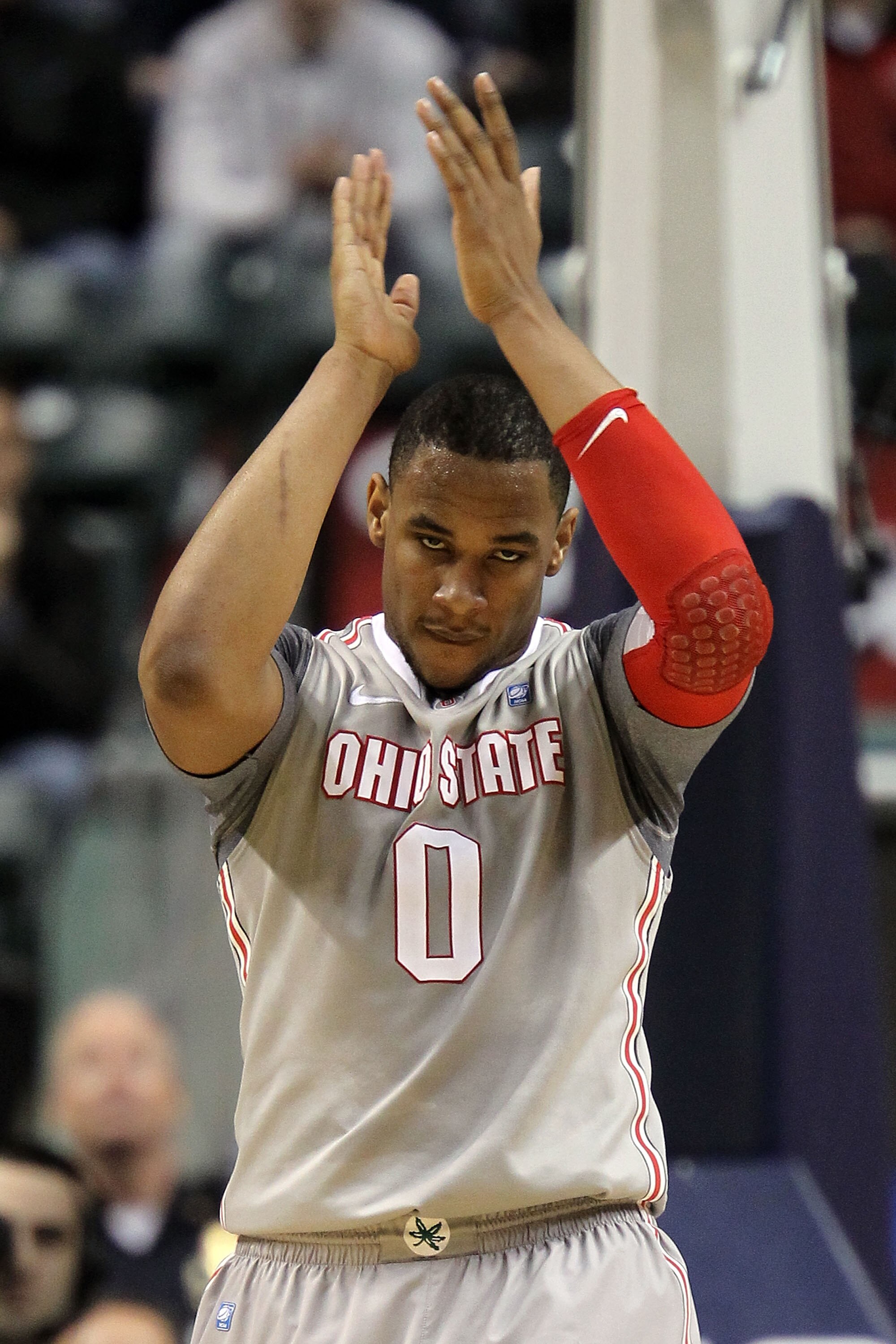 INDIANAPOLIS, IN - MARCH 13:  Jared Sullinger #0 of the Ohio State Buckeyes celebrates a play against the Penn State Nittany Lions during the championship game of the 2011 Big Ten Men's Basketball Tournament at Conseco Fieldhouse on March 13, 2011 in Indi